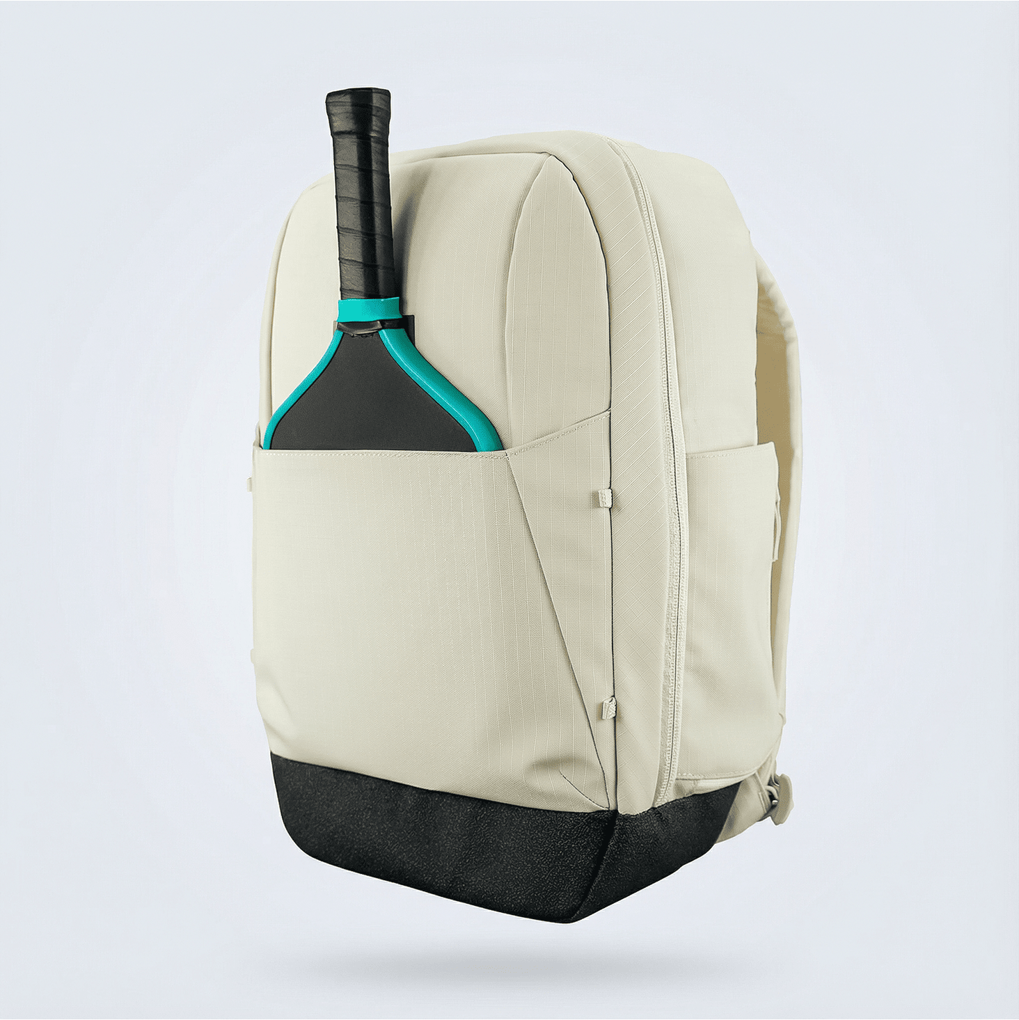 Light beige pickleball backpack by FORWRD, featuring a black textured base and a side pocket holding a black and teal paddle.