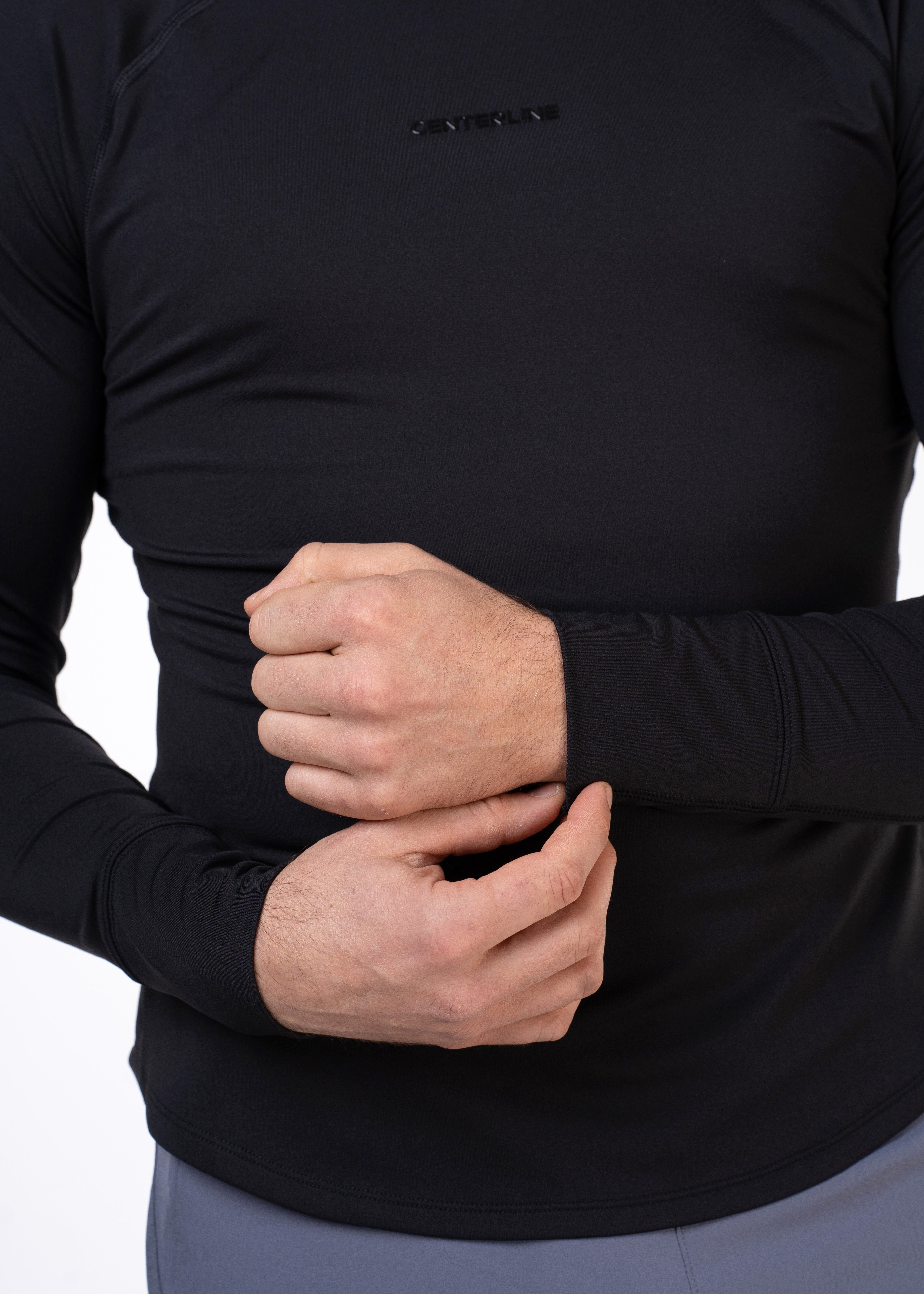 Man modeling black long-sleeve shirt.