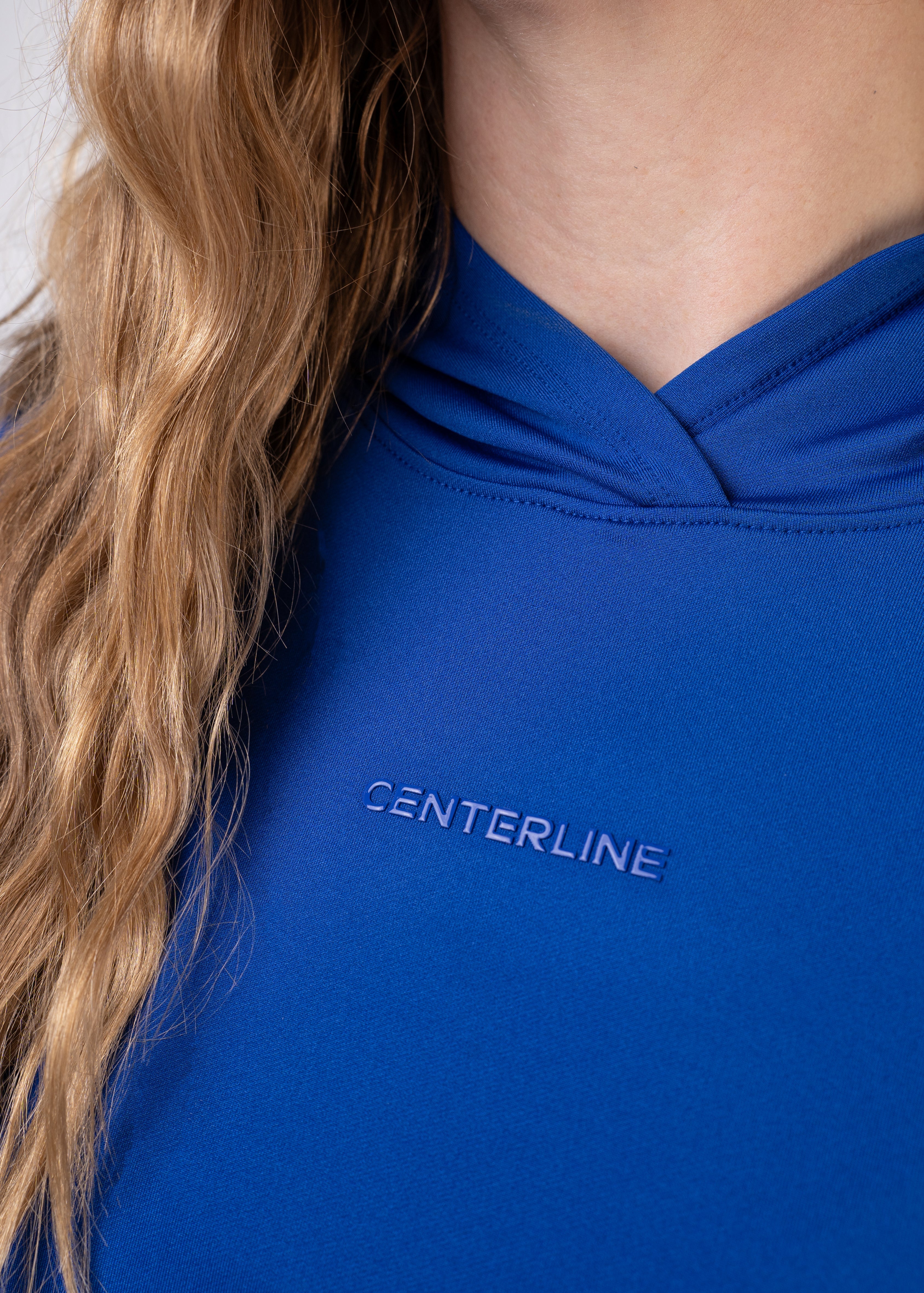 Blue athletic hoodie with "CENTERLINE" text.