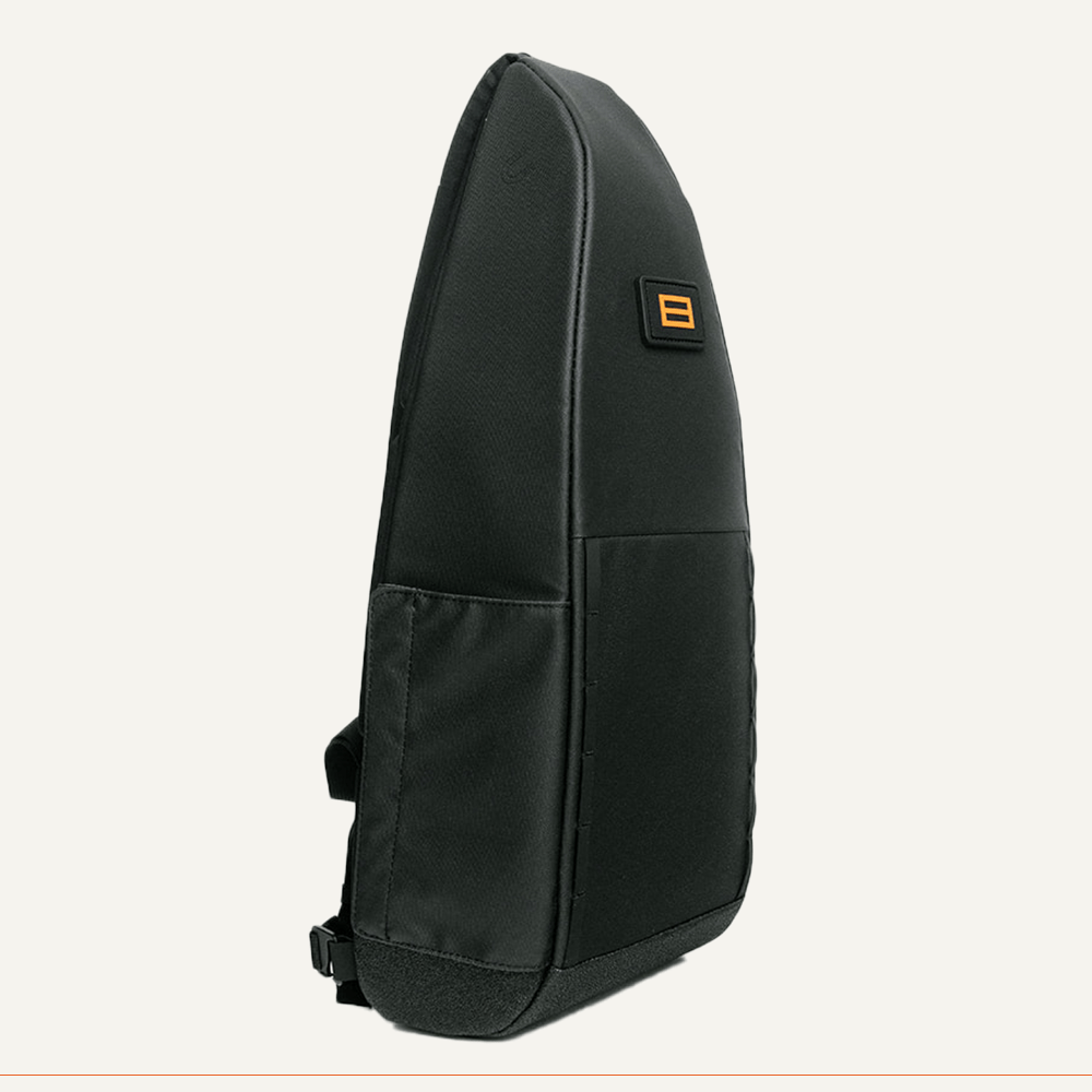 Black backpack with an orange square logo.