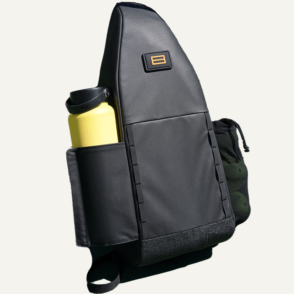 Black sling bag with yellow water bottle.