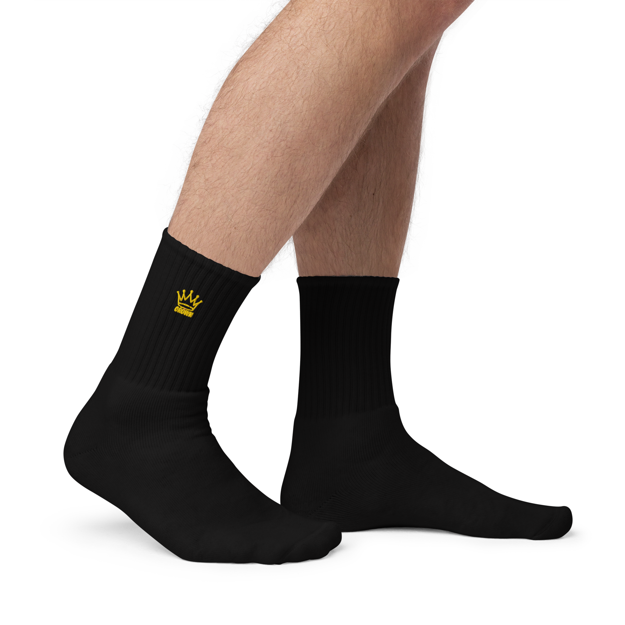 Black ribbed socks with yellow crown embroidery.