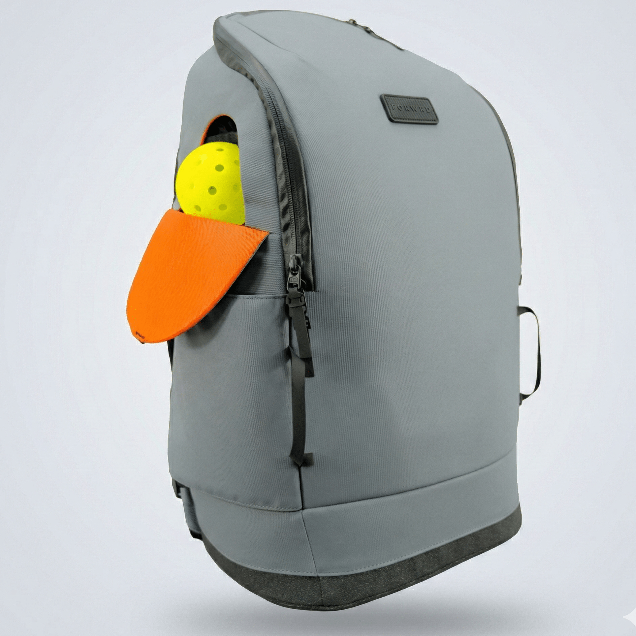 Grey Pickleball Backpack by FORWRD with a side pocket holding a yellow pickleball and orange paddle.