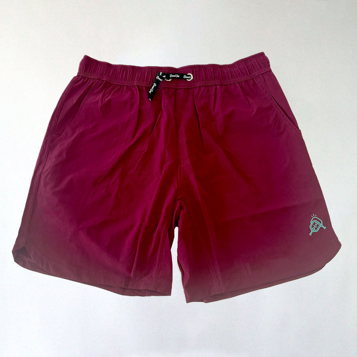Burgundy men's athletic shorts with logo.