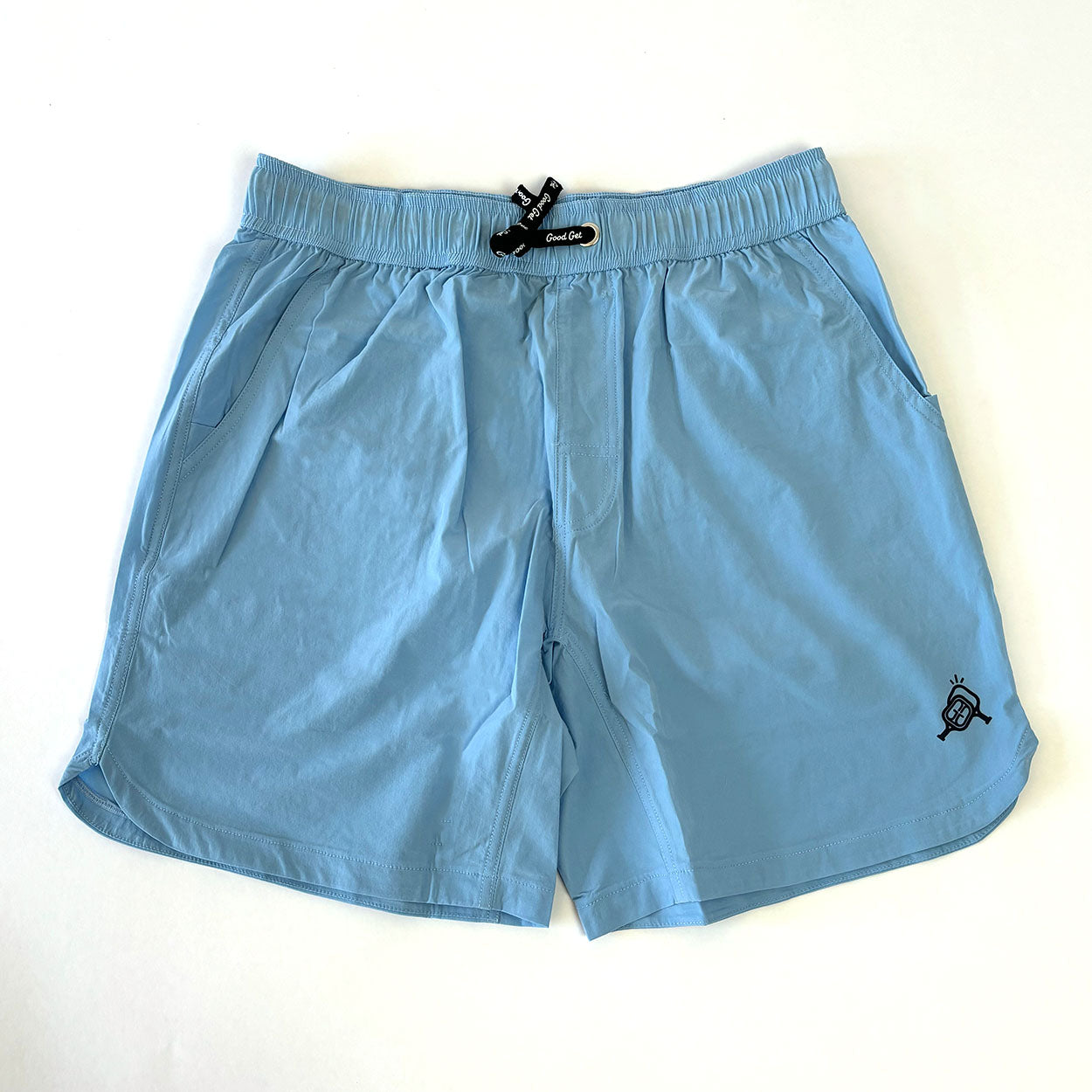 Light blue shorts with a black logo.