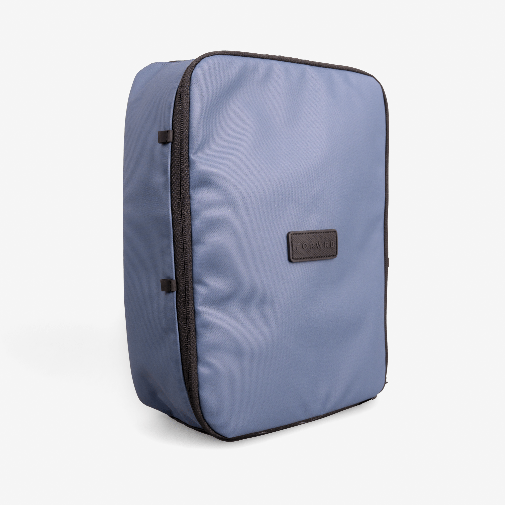 Periwinkle blue fabric shoe cube by FORWRD, featuring a dark brown logo patch and black zipper trim, shown upright.