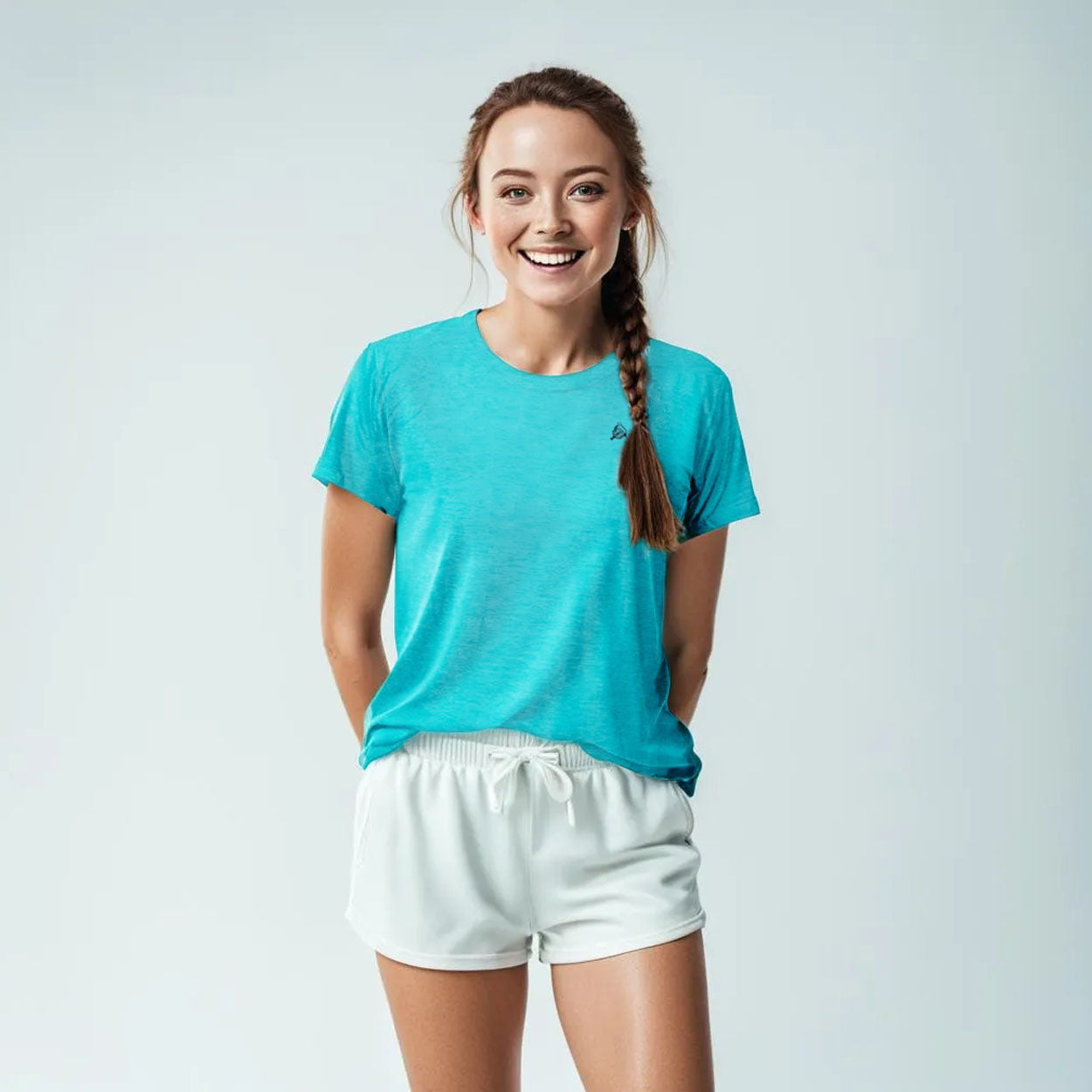 Woman in blue T-shirt and white shorts.