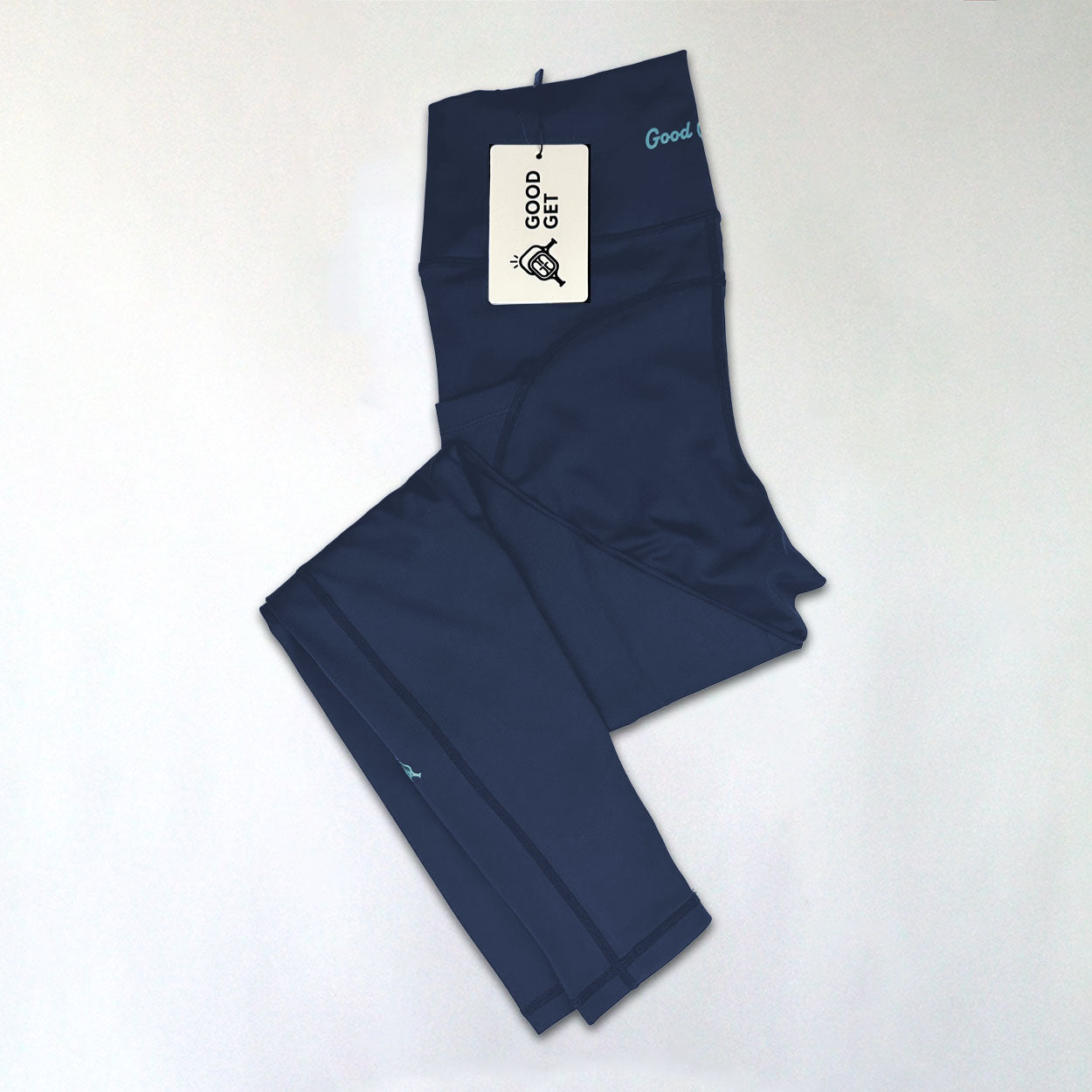 Folded navy blue leggings with a tag.