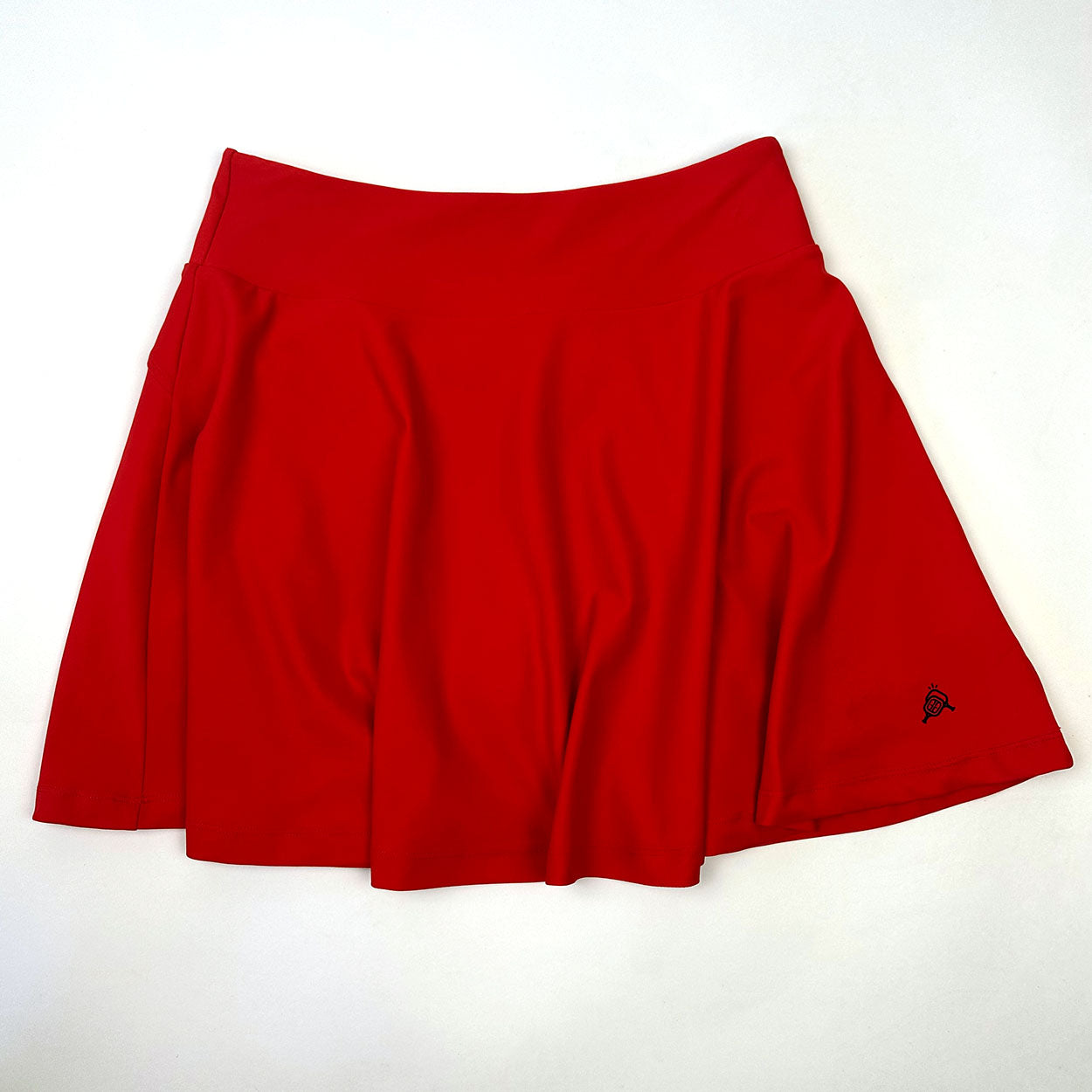 Red skirt with a black logo.