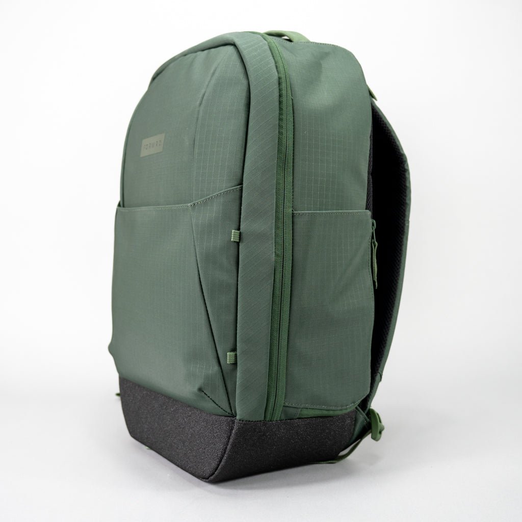 Green backpack with a black base.