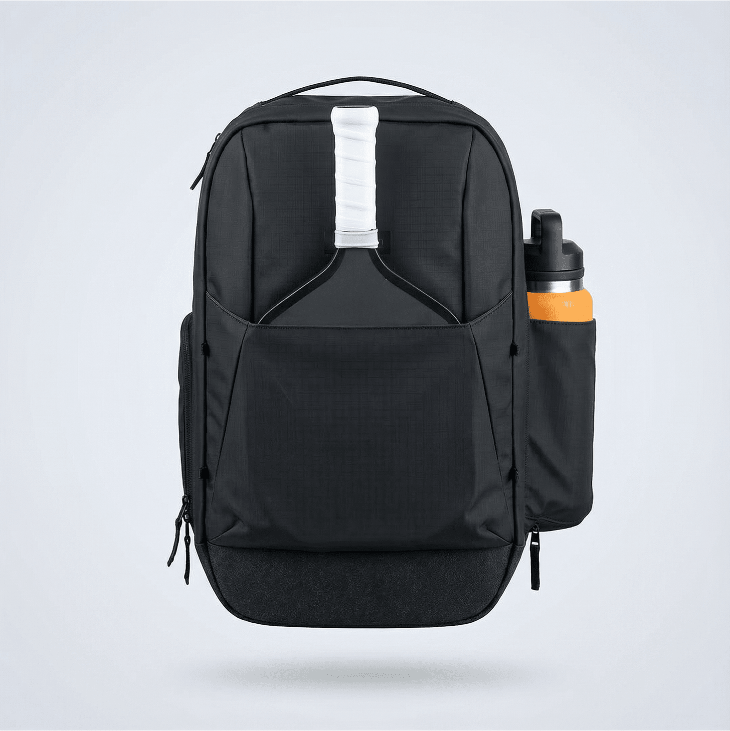 Black Pickleball Backpack by FORWRD with a pickleball paddle in the front pocket and an orange water bottle in the side pocket.