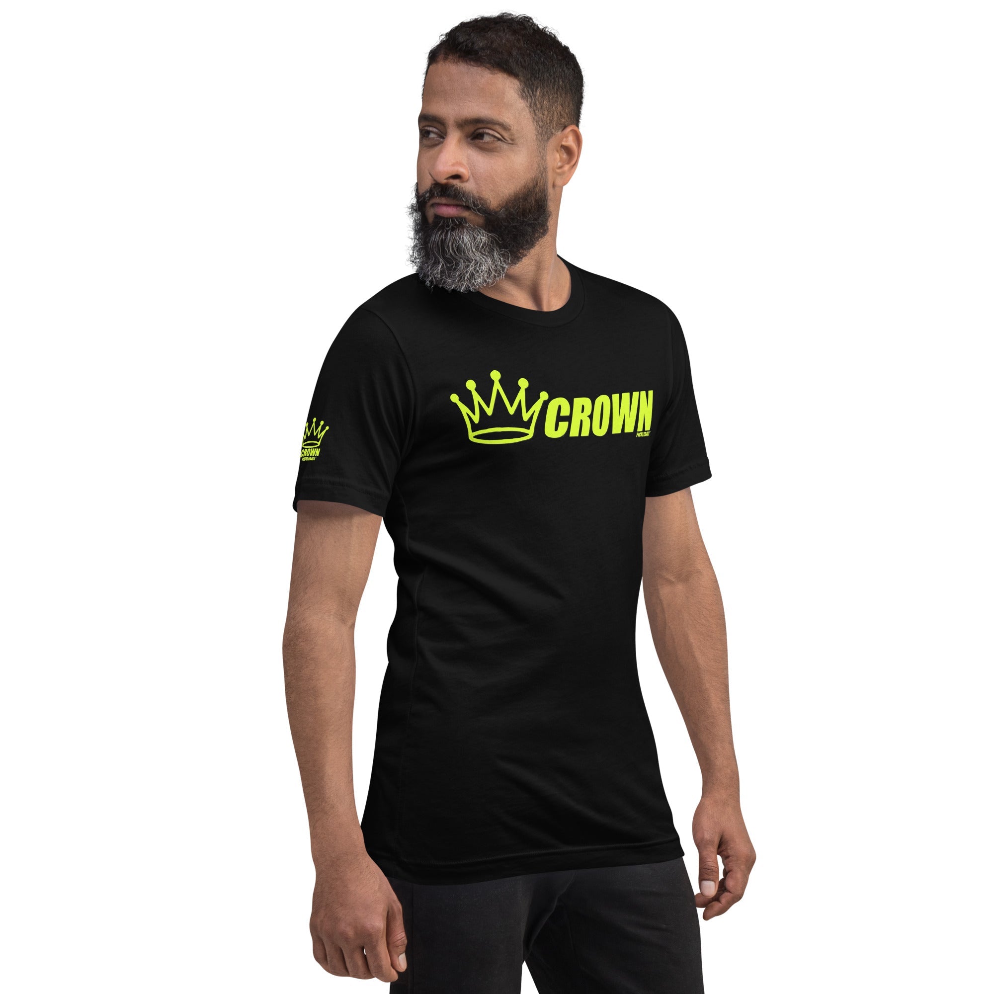 A man wearing a black t-shirt with a neon green "Crown Pickleball" logo.
