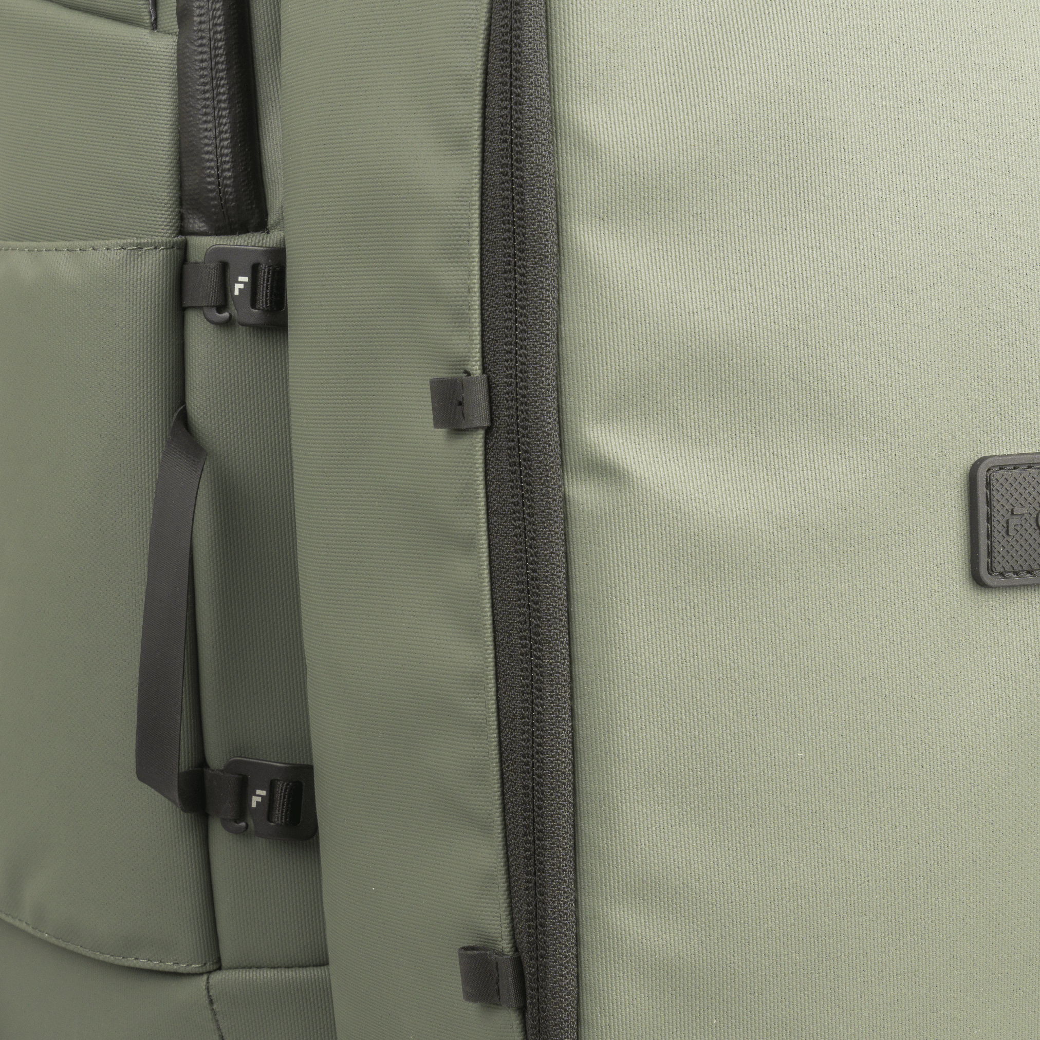 Sage green Shoe Cube by FORWRD, featuring ribbed fabric, a dark grey zipper, F-logo buckles, and an embossed logo.