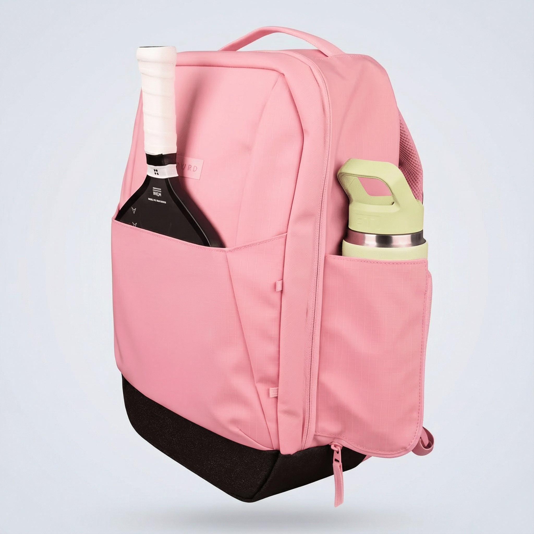 Pink ripstop pickleball backpack by FORWRD, holding a paddle and light green water bottle in side pockets, and a black base.