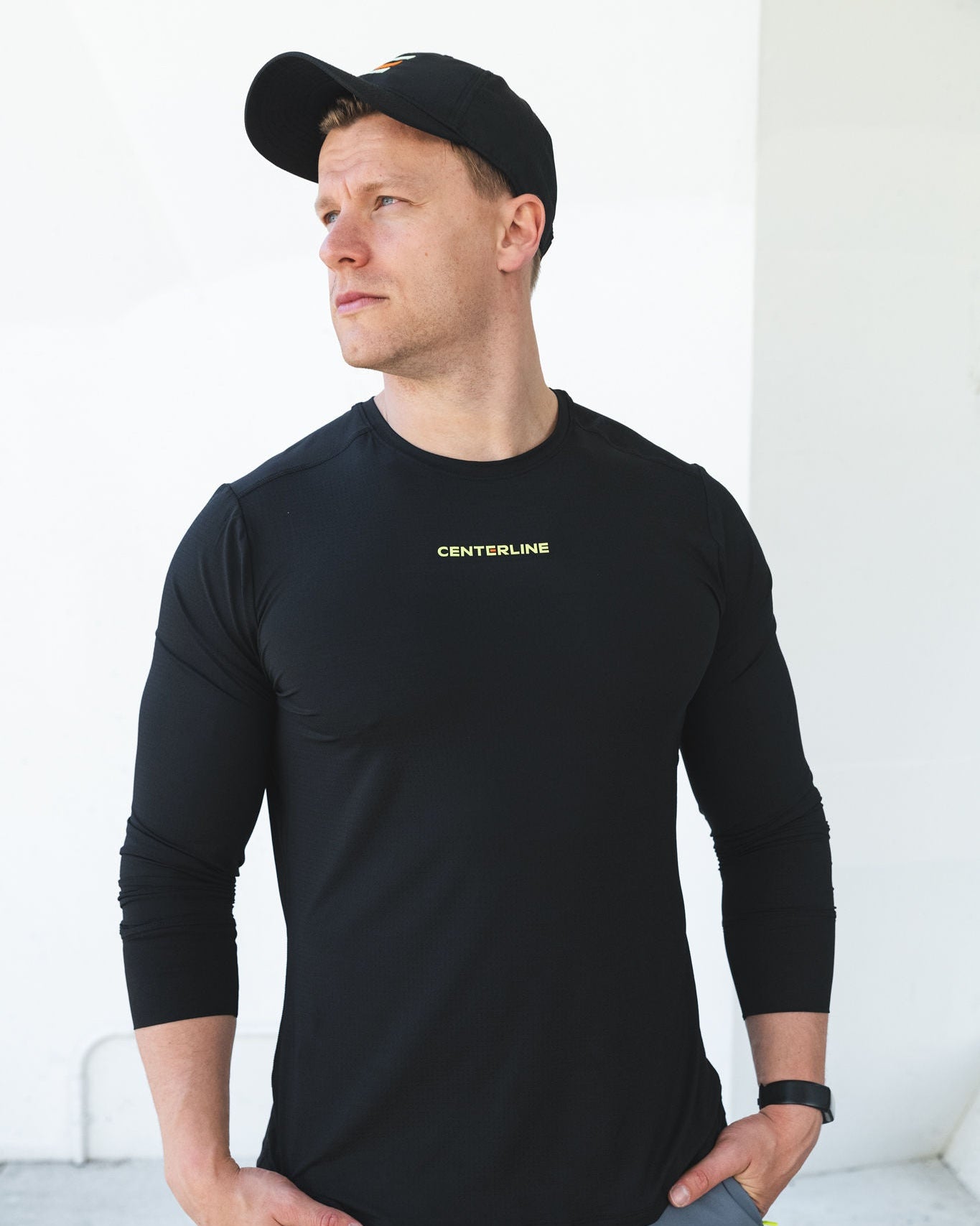 Man in black long sleeve shirt and hat.