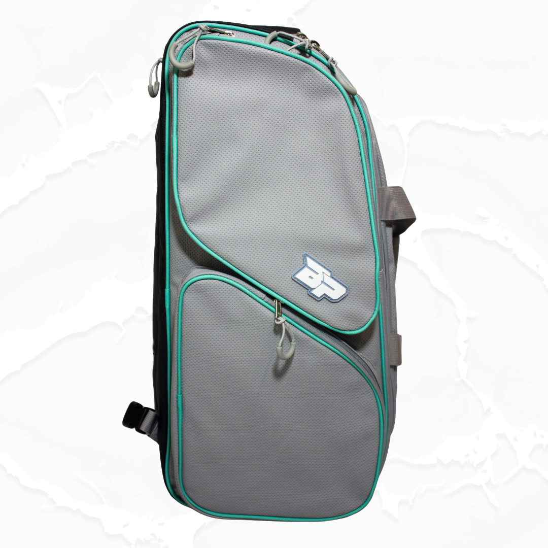 Grey textured duffle bag by Bodhi Pickleball with teal piping, multiple zippered pockets, and a white 'BP' logo.