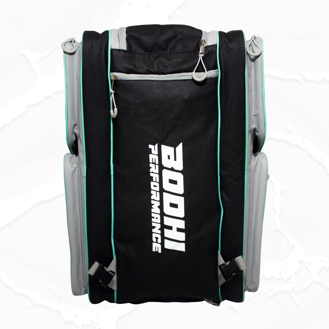 Black and grey duffle bag by Bodhi Pickleball, with a vertical white logo, aqua piping, and mesh side panels, from the back.