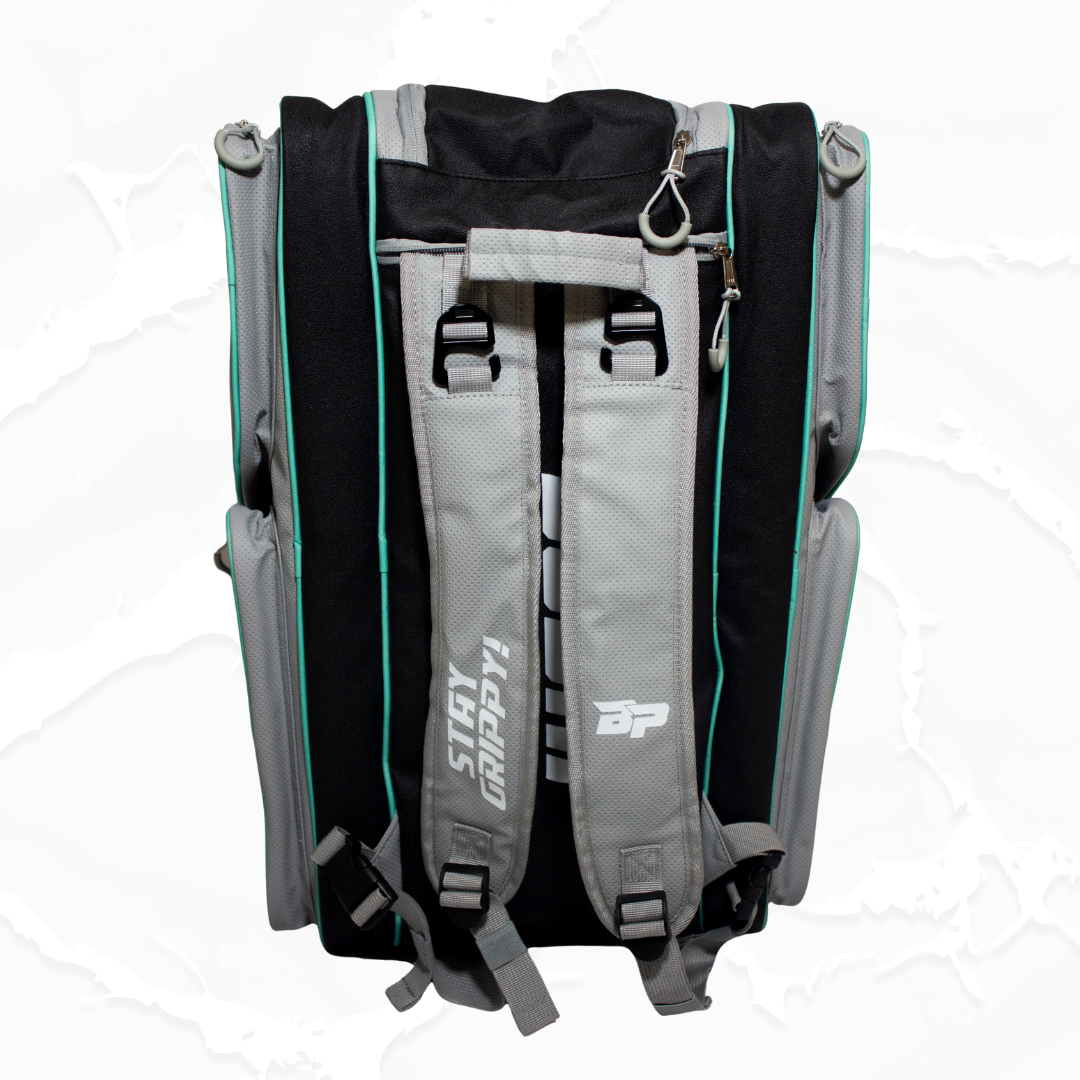 Black and grey duffle bag by Bodhi Pickleball, with mint green piping and padded back straps featuring 'STAY GRIPPY!' and 'BP' logos.