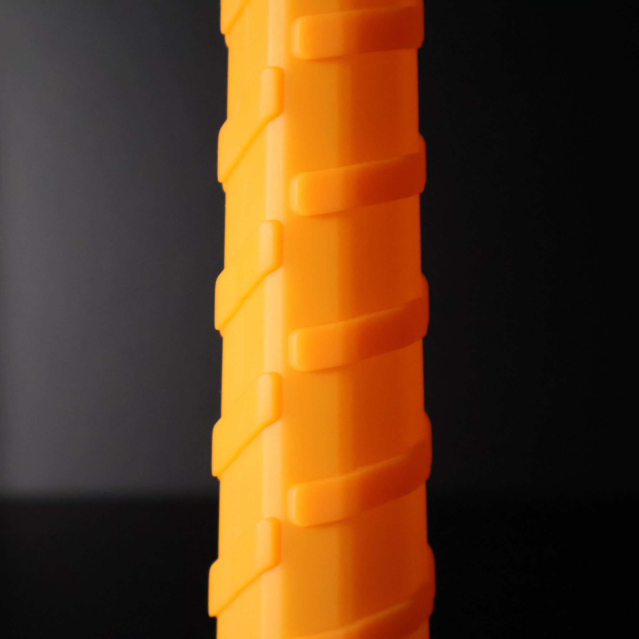 Vibrant orange Pro Undergrip by Ethos Pickleball, featuring a textured, spiraling raised pattern.