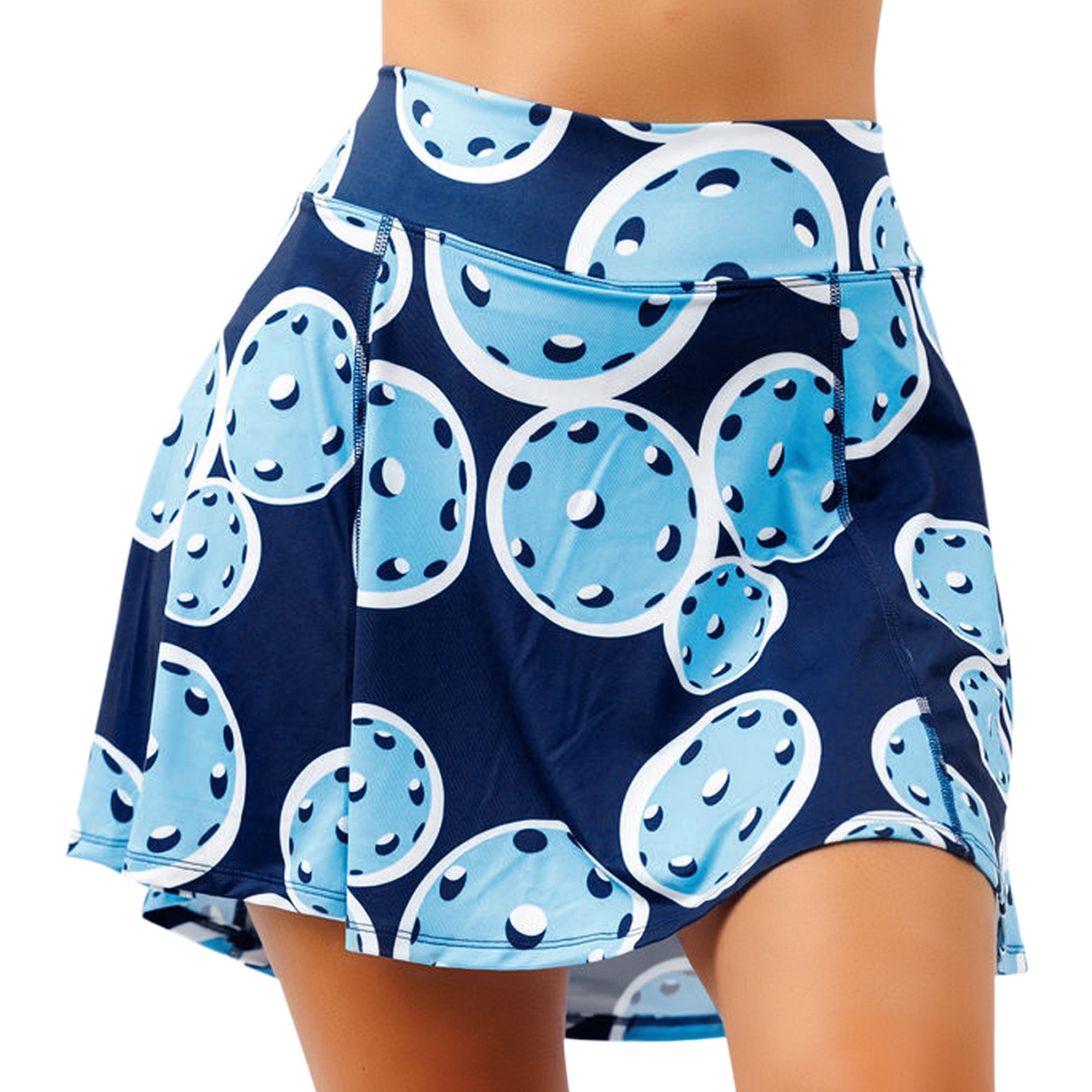 Navy blue A-line skort by Pickleball Bella, featuring a vibrant light blue and white pickleball ball pattern.