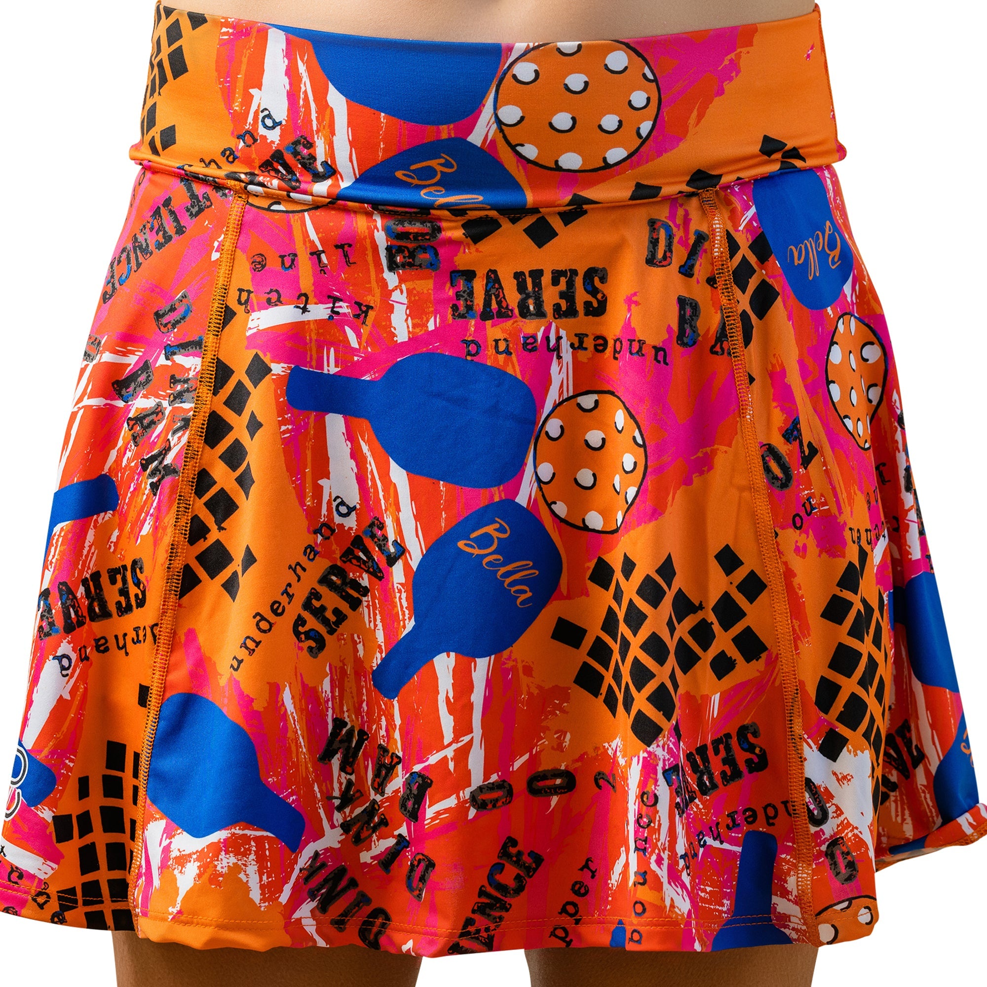 Orange and pink graffiti A-line skort by Pickleball Bella, featuring paddles, balls, and text.