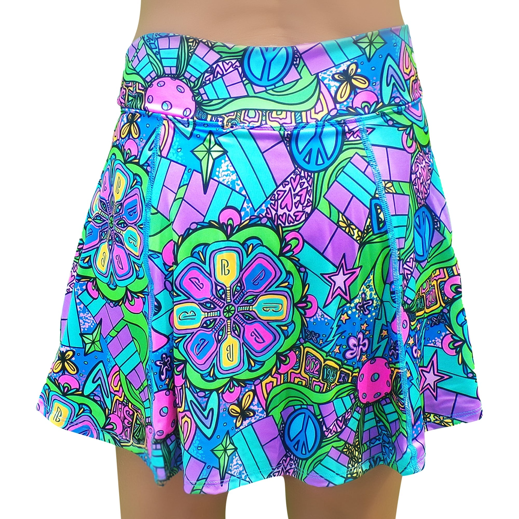 Groovy A-line skort by Pickleball Bella, featuring a vibrant psychedelic pattern with peace signs, mushrooms, and abstract shapes.