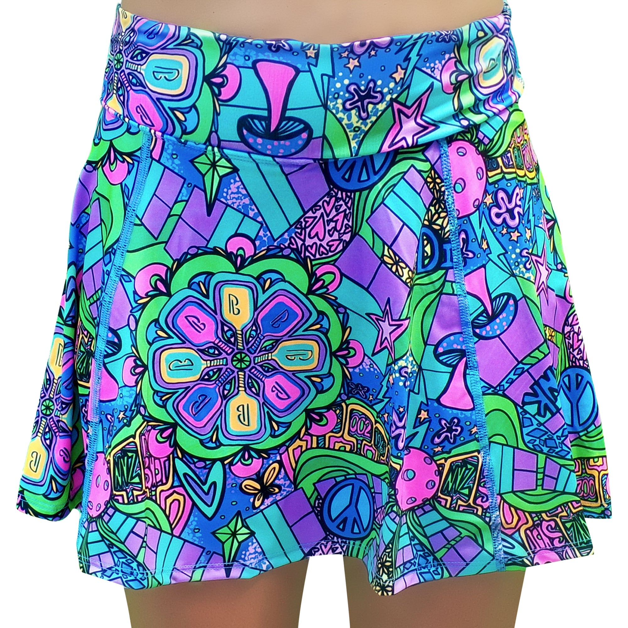 Colorful psychedelic A-line skort by Pickleball Bella, featuring abstract shapes, stars, peace signs, and a central paddle mandala design.