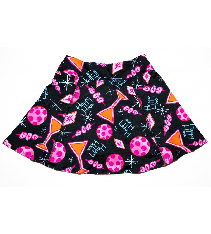Black A-line skort by Pickleball Bella with orange martini, pink polka dot, and Happy Hour text pattern.
