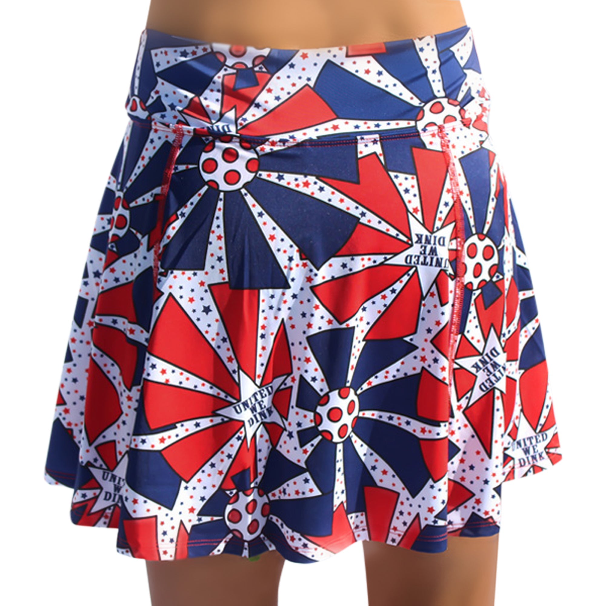 Red, white, and blue A-line skort by Pickleball Bella with patriotic stars, pickleball graphics, and "UNITED WE DINK" text.
