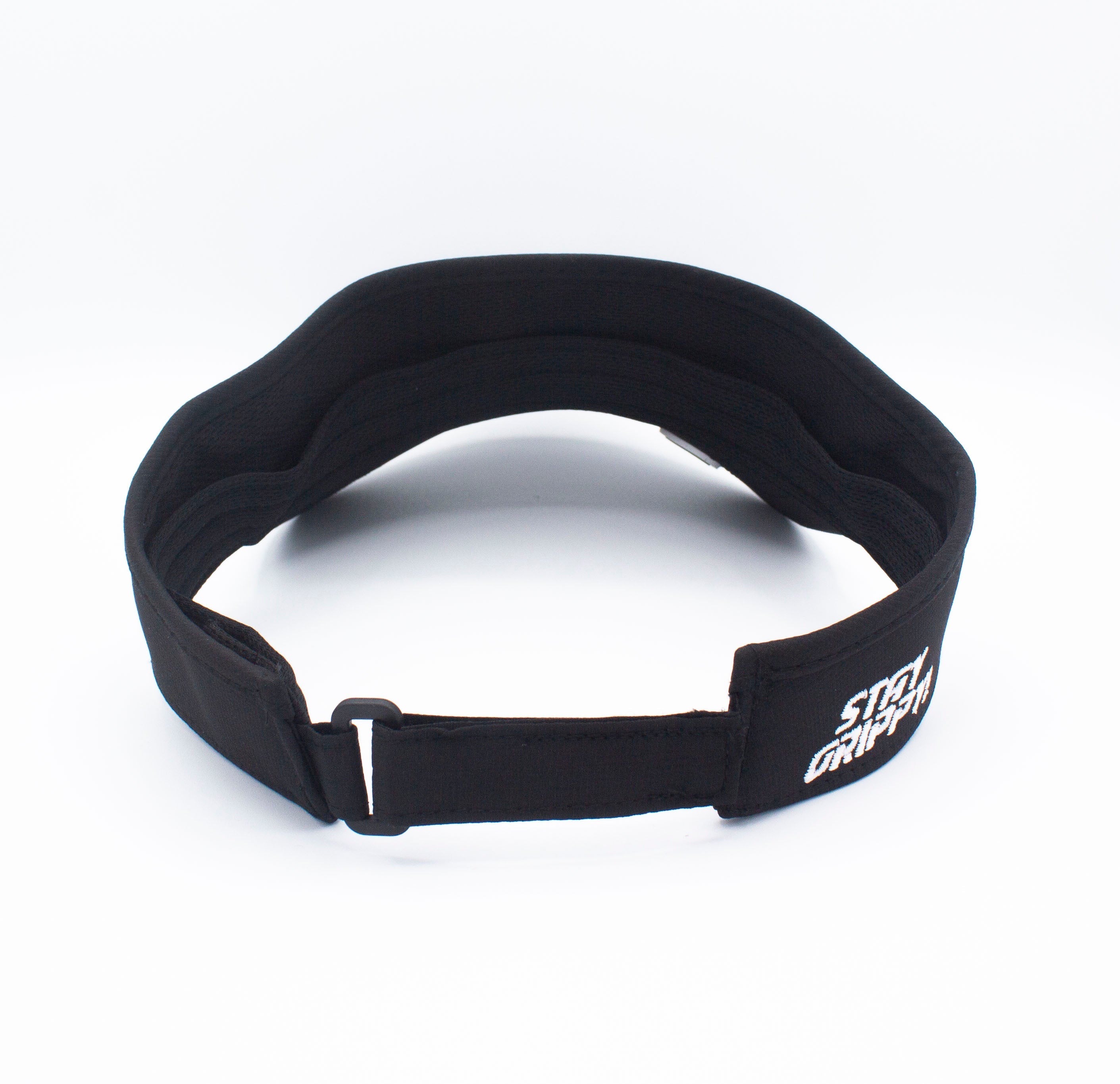 Back view of a black visor with white text.