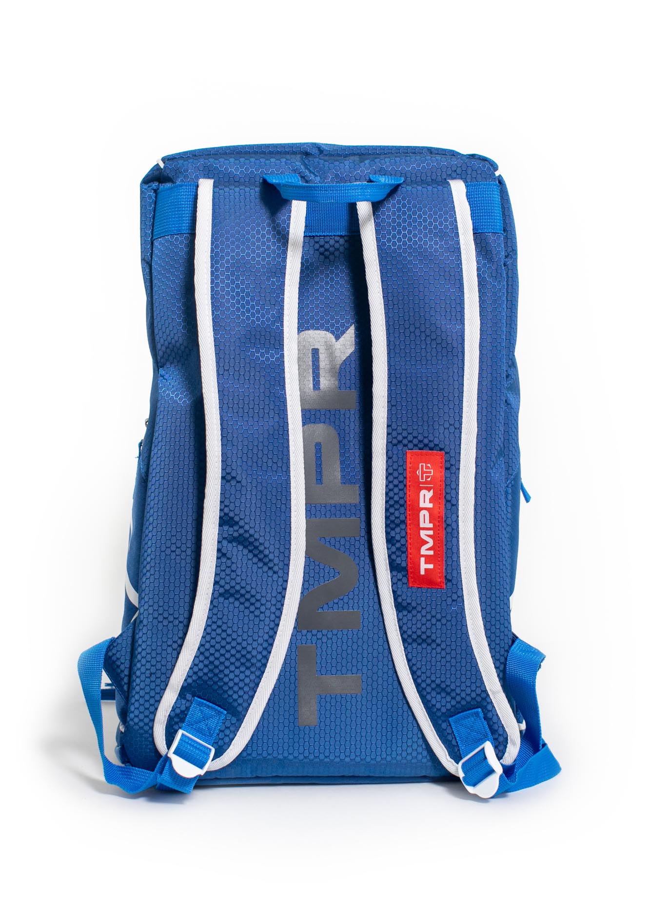 Blue sporting backpack by TMPR Sports, featuring a hexagonal texture, large gray "TMPR" text, white shoulder straps, and a red brand tag on the back.
