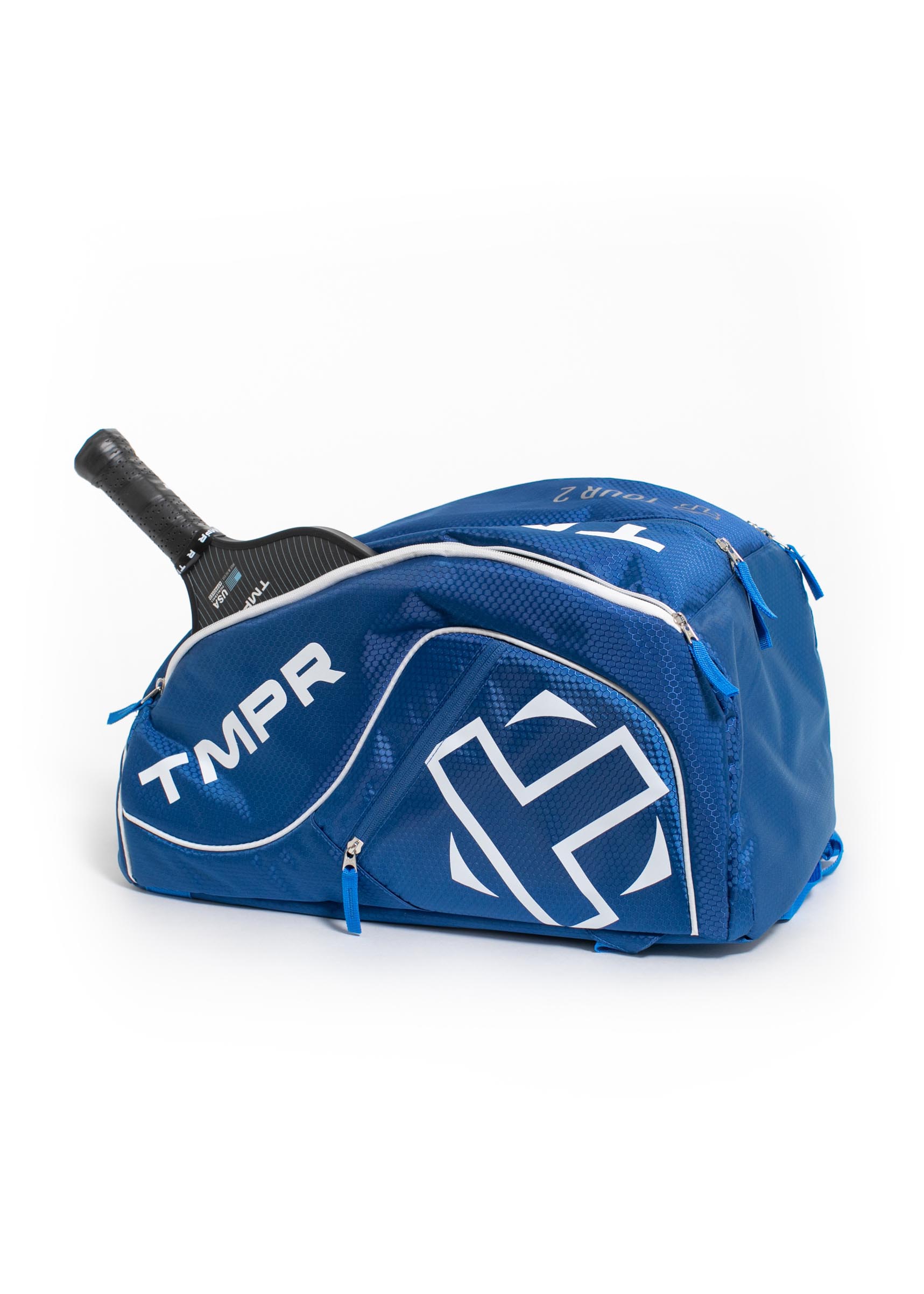 Blue pickleball backpack by TMPR Sports, featuring a white logo, honeycomb texture, and a paddle partially inserted.