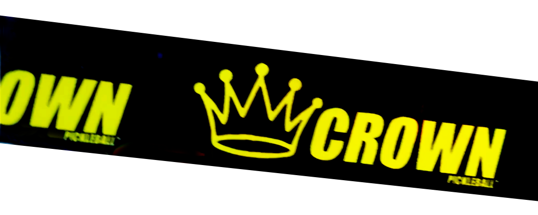 Black Crown pickleball product with yellow text and crown logo.