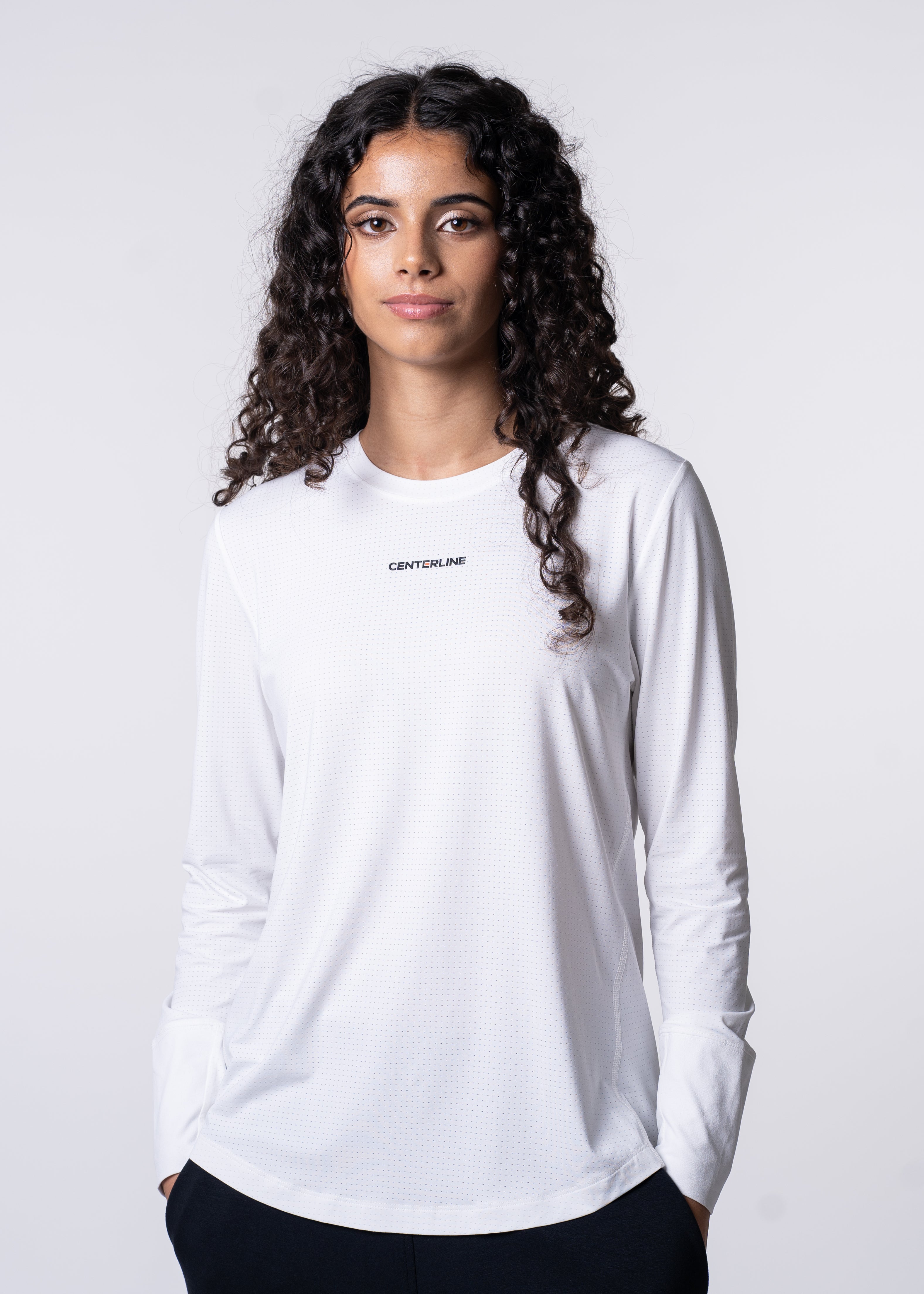 Woman in white long-sleeved athletic shirt.