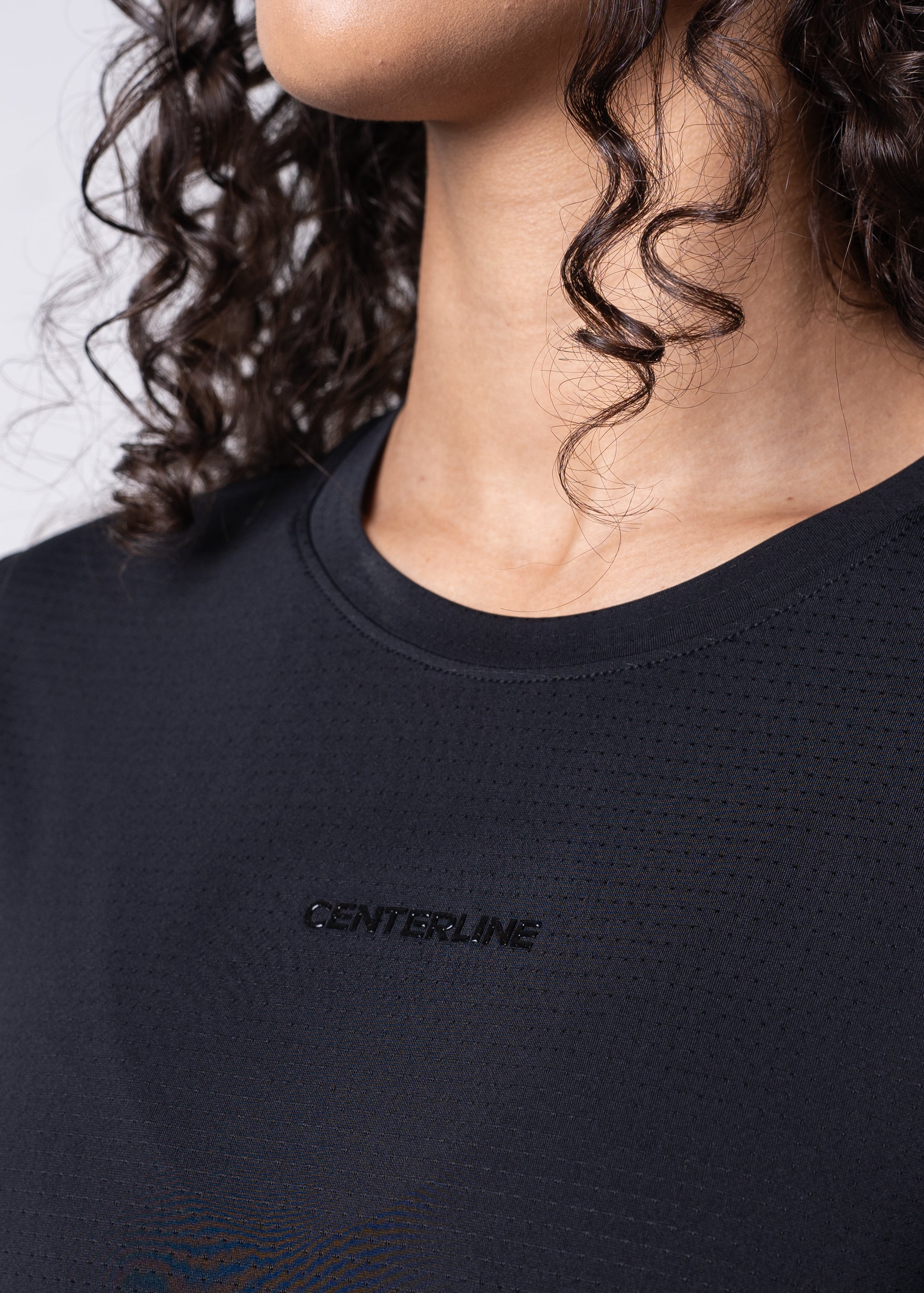 Black performance shirt with "CENTERLINE" logo.
