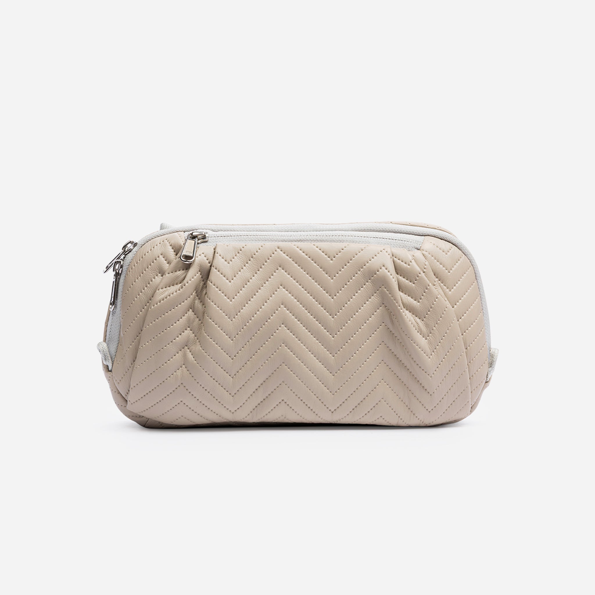 Beige chevron quilted cosmetic bag.