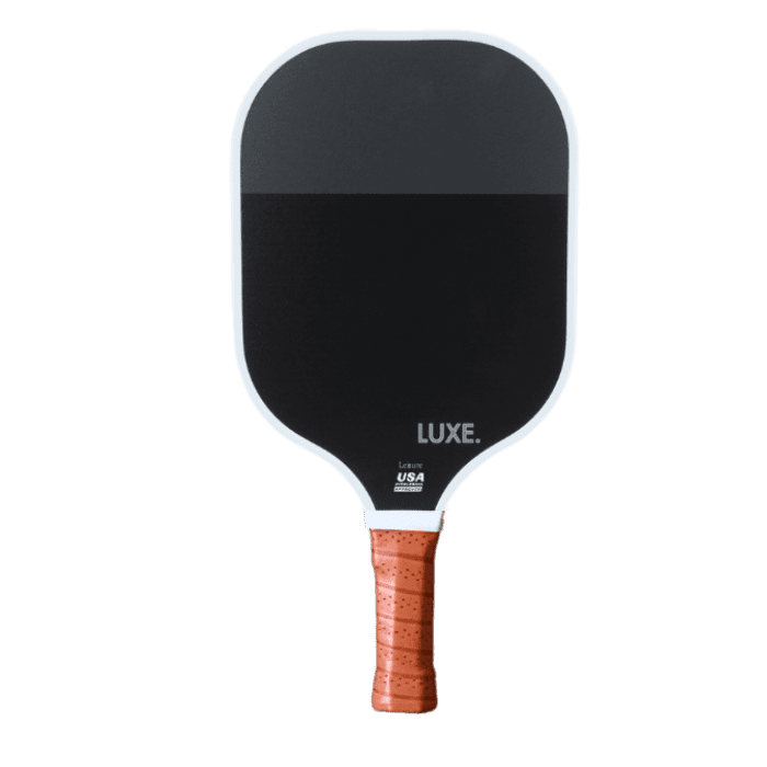 Black and white pickleball paddle with a brown grip.