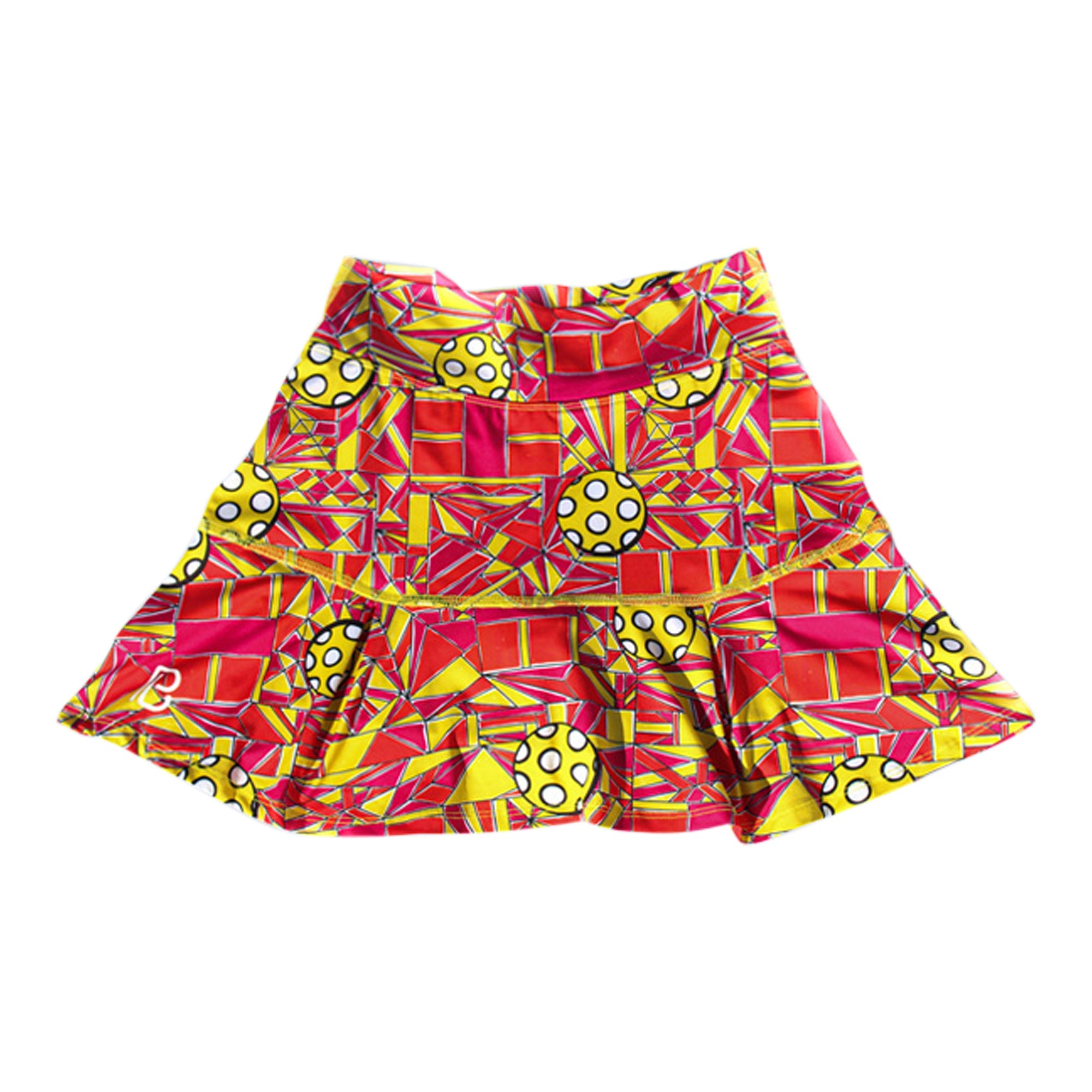 Red and yellow patterned drop pleat skort by Pickleball Bella, featuring geometric shapes and pickleball spheres.