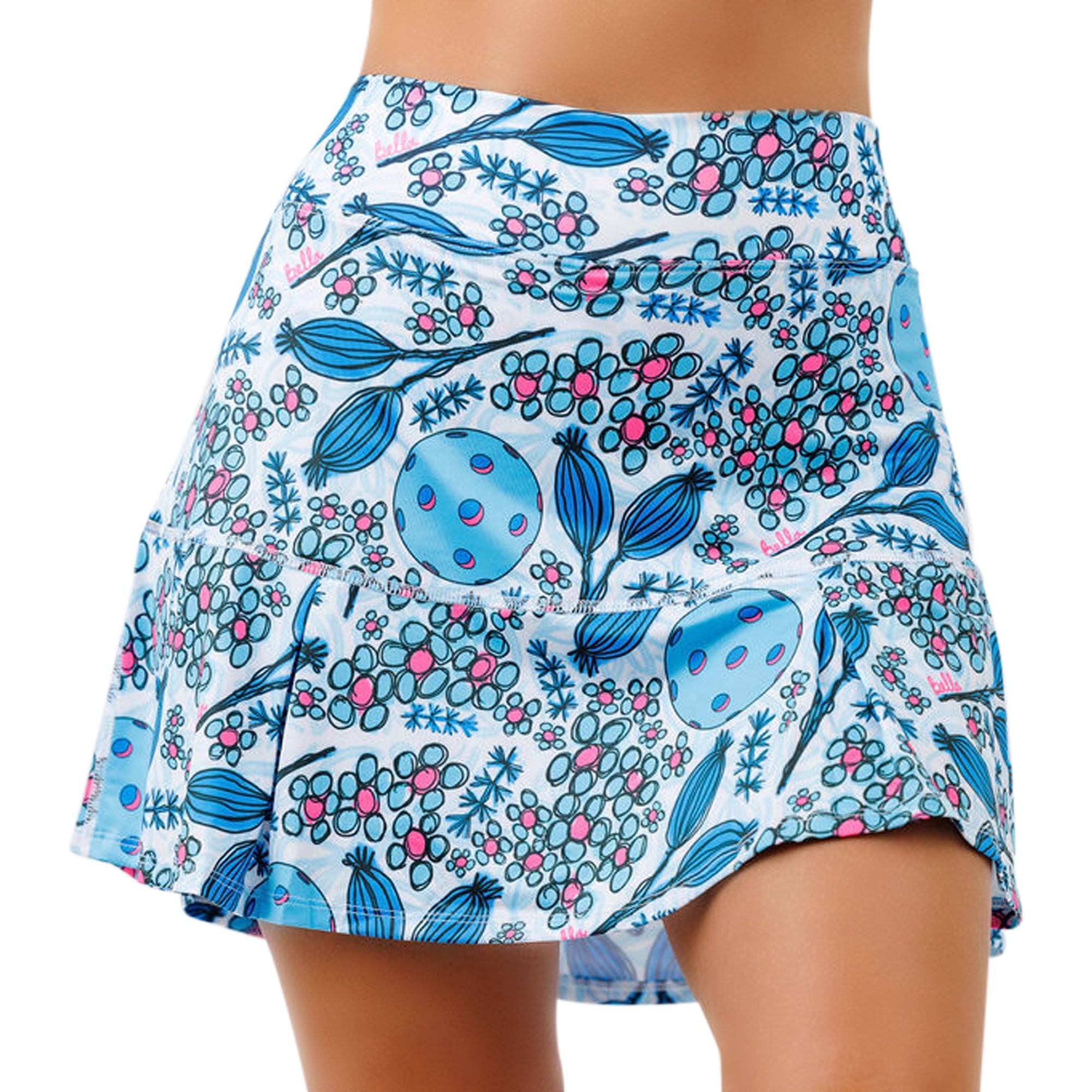 Light blue and pink floral pickleball print drop pleat skort by Pickleball Bella, worn by a person, hip-level view.