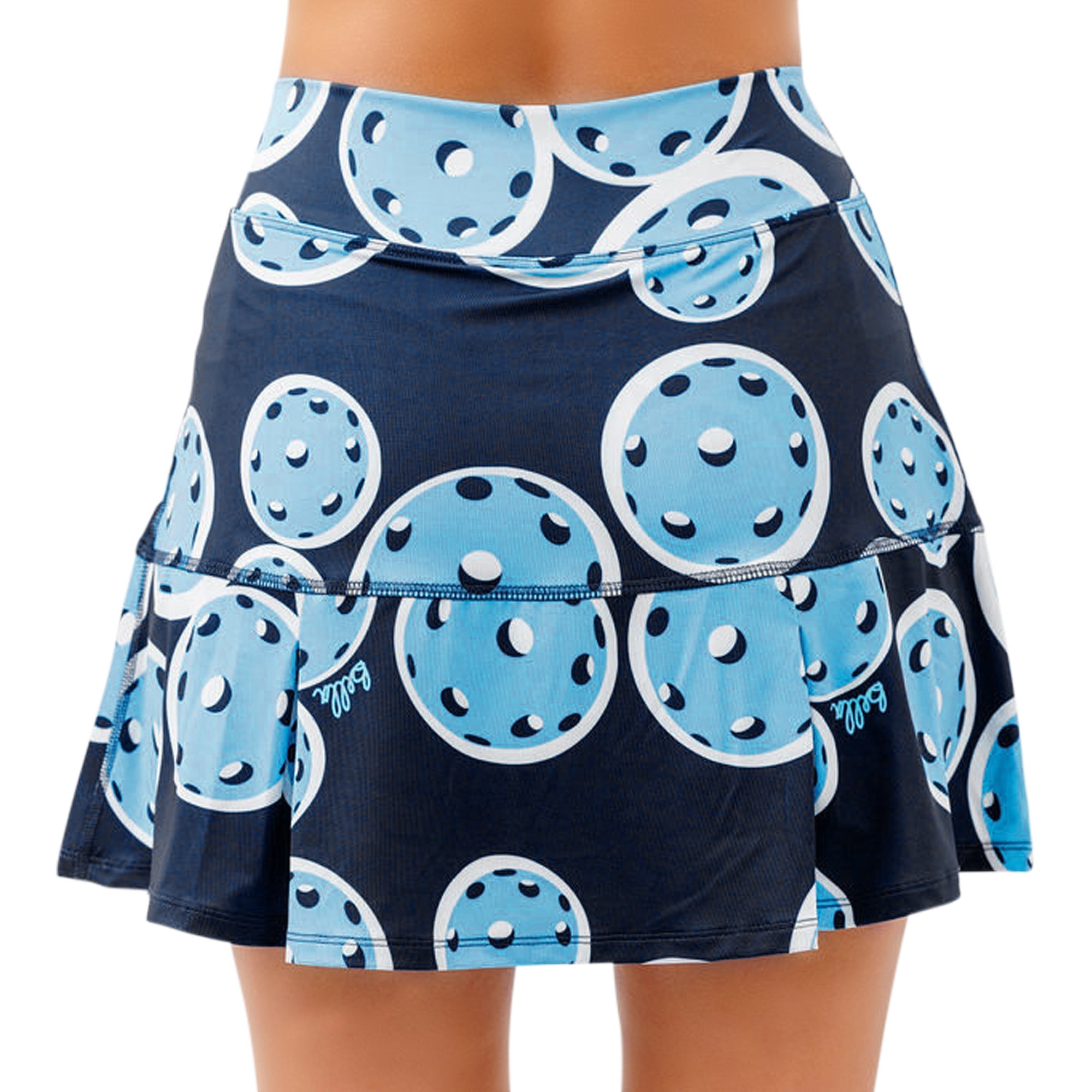 Dark blue drop pleat skort by Pickleball Bella, with a light blue pickleball pattern and Bella logo, shown from the back.