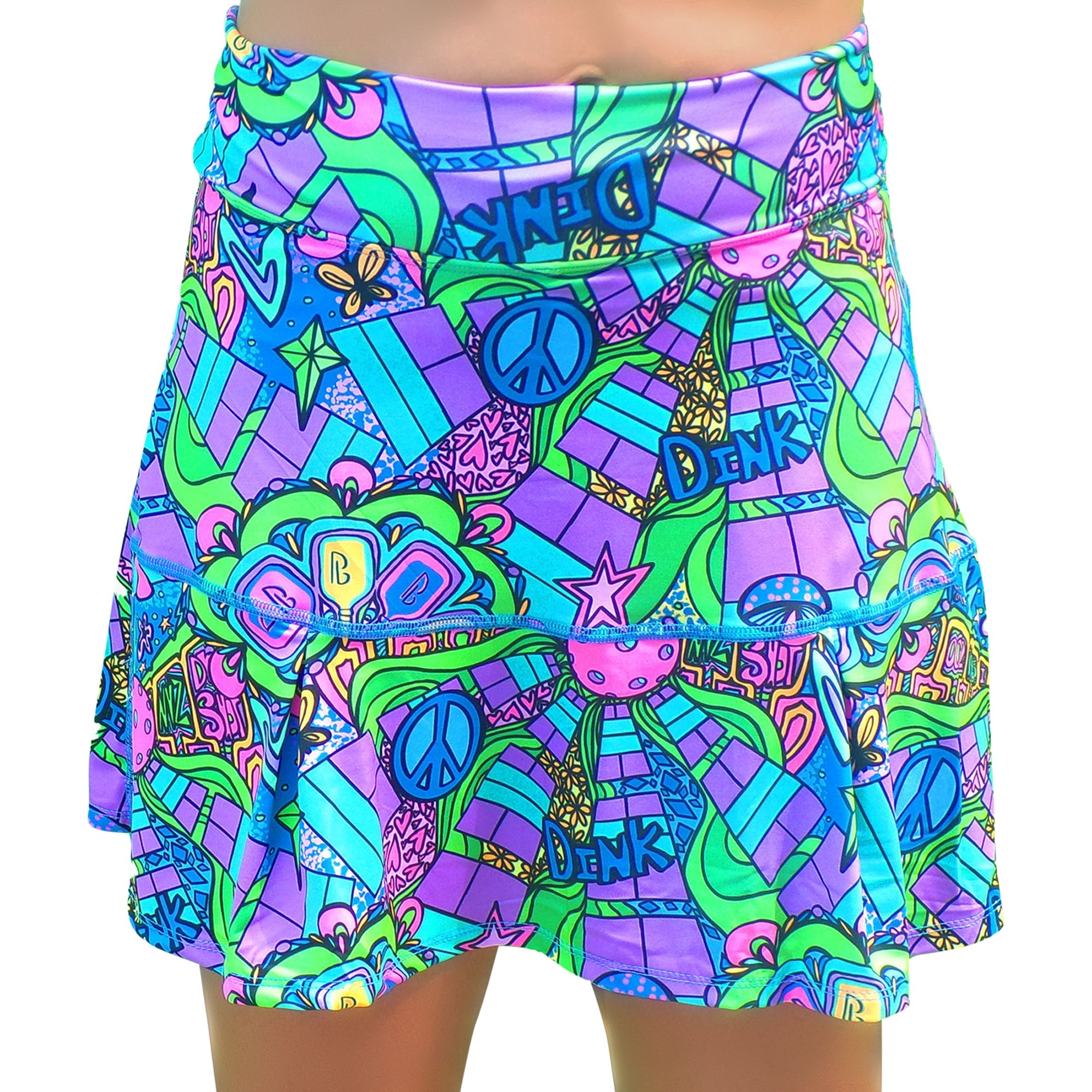 Groovy multi-colored drop pleat skort by Pickleball Bella, featuring peace signs, stars, and 'DINK' text.