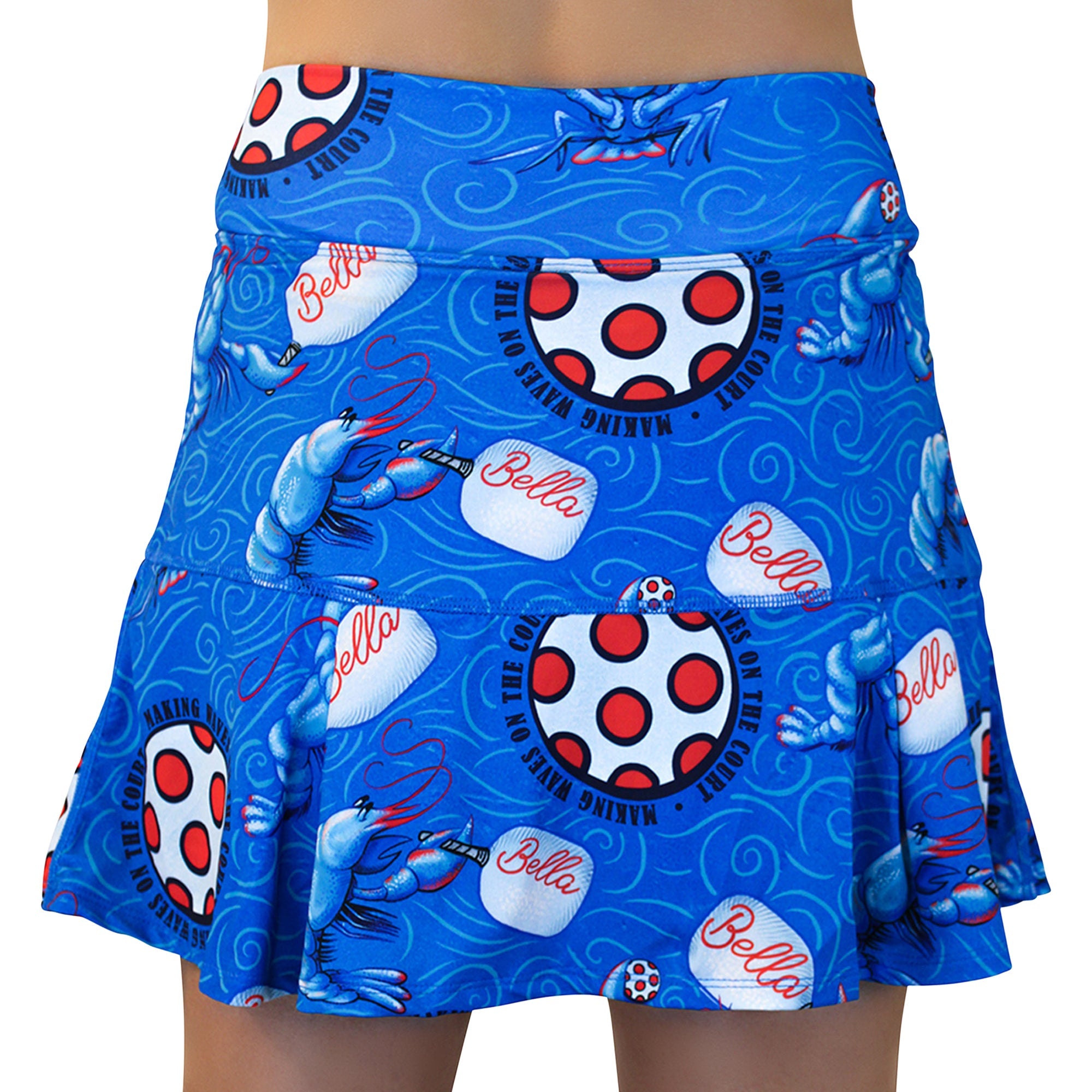 Blue drop pleat skort by Pickleball Bella, with a pattern of lobsters, paddles, polka-dot tennis balls, and "MAKING WAVES ON THE COURT" text.