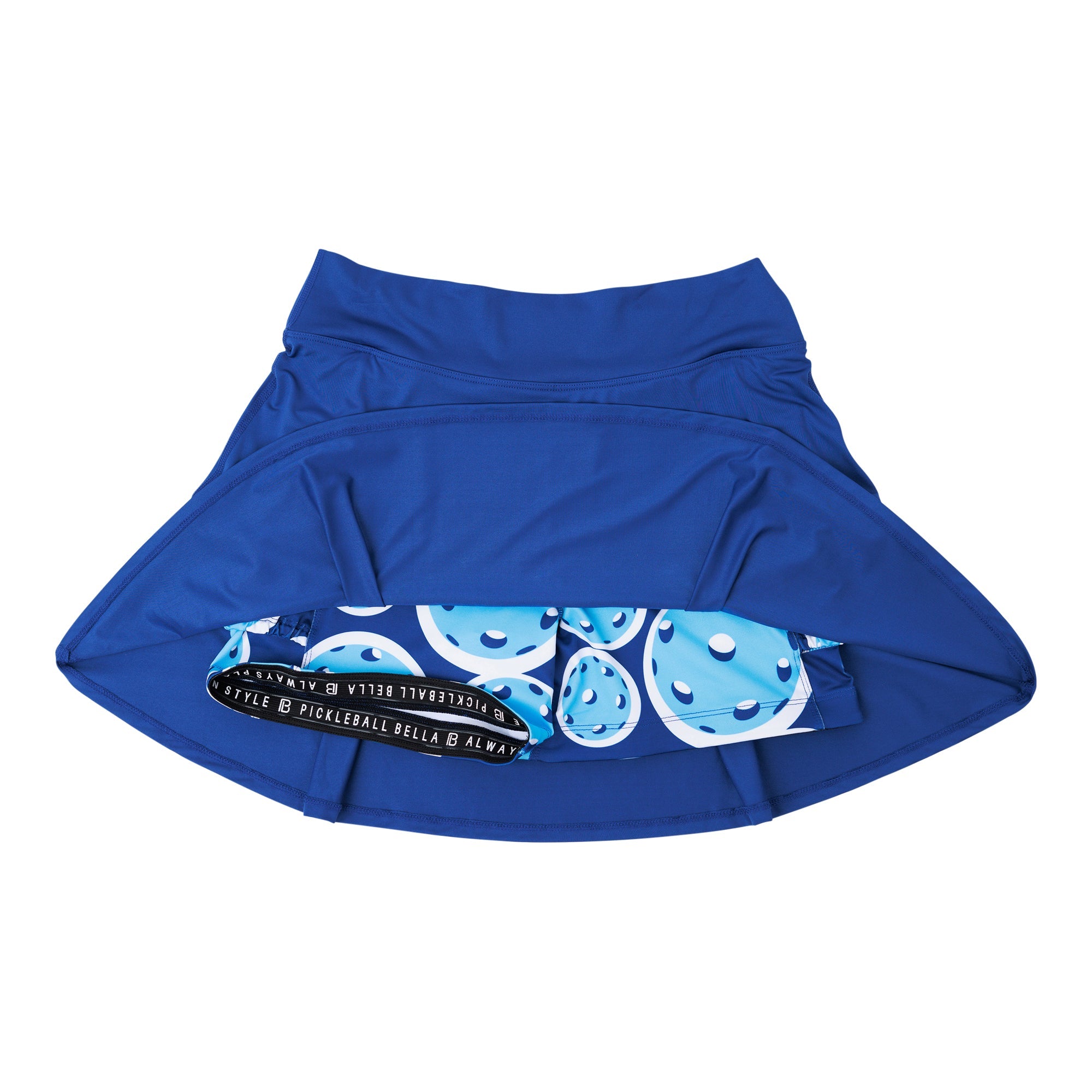Navy pleat skort by Pickleball Bella, with blue and white pickleball pattern on inner shorts, and a black elastic waistband with logo text.