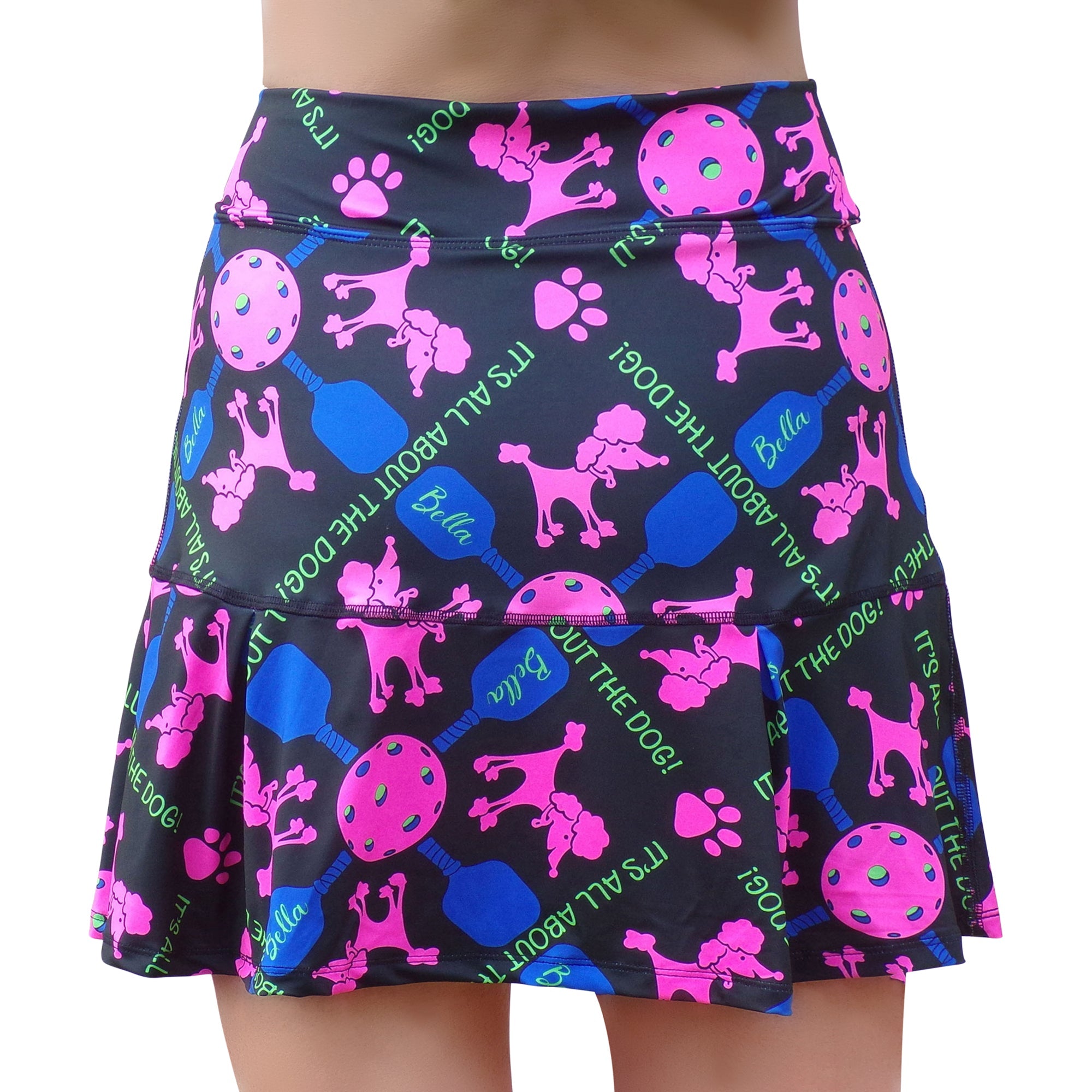 Black drop pleat skort by Pickleball Bella with a vibrant pink poodle, pickleball, and paw print pattern.