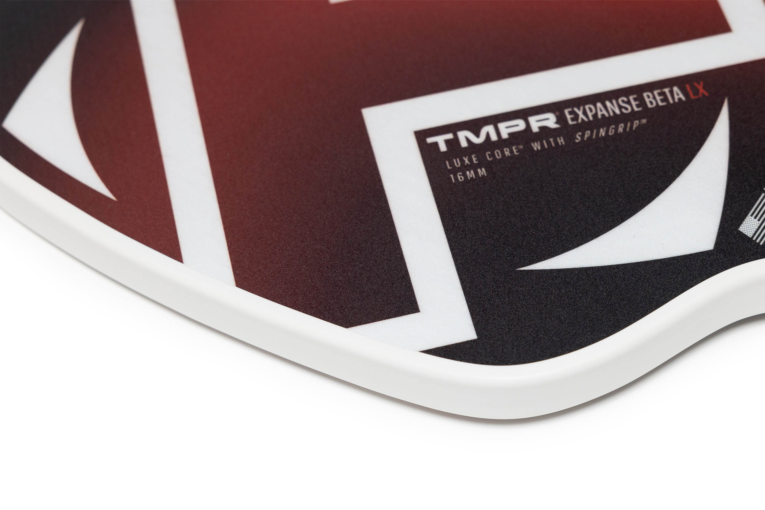 Red and black textured pickleball paddle by TMPR Sports, with white geometric patterns, a white edge, and red 'LX' lettering.