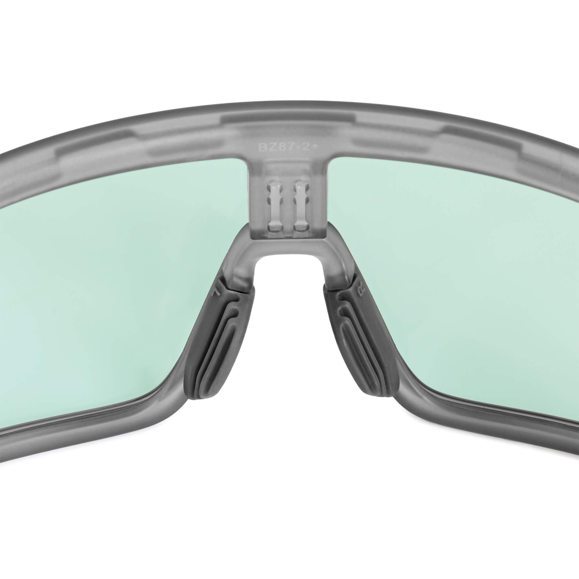 Dark gray, grooved nose pads by BRIOTI, attached to a gray sports glasses frame with light green lenses, showing "BZ87-2+".