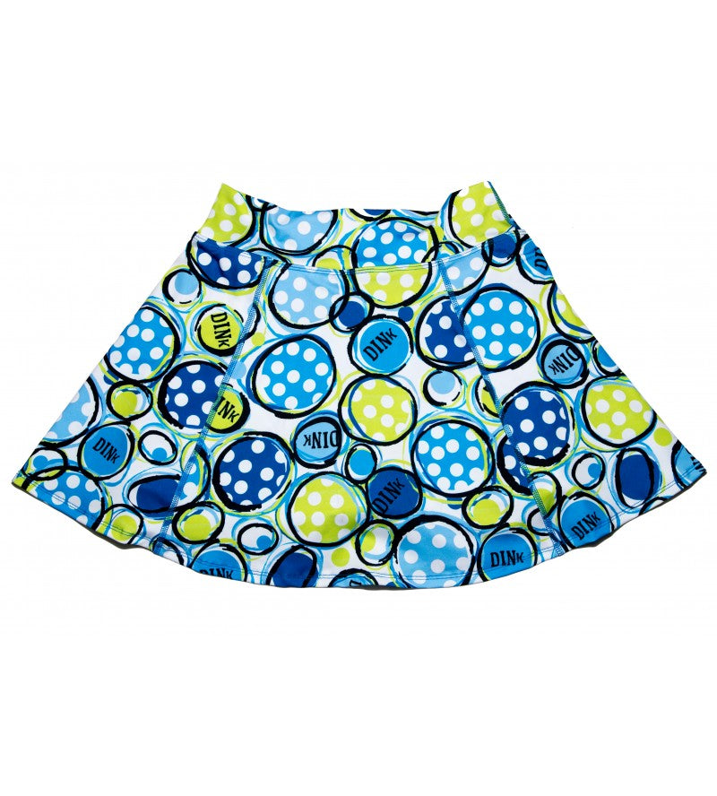 Blue, lime green, and white A-line skort by Pickleball Bella, with a polka dot circle pattern and 'DINK' text.