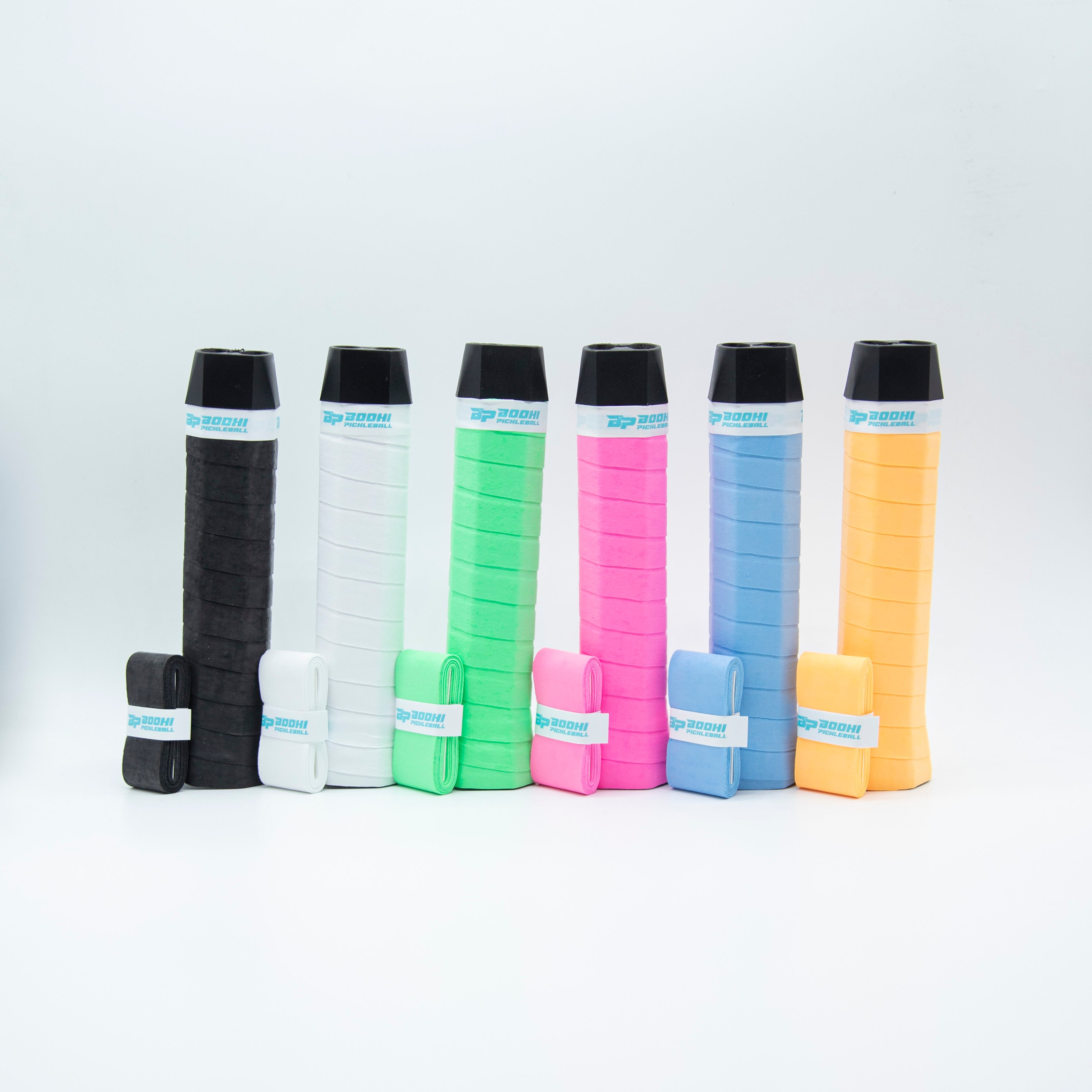 Six colorful, wrapped pickleball paddle grips.