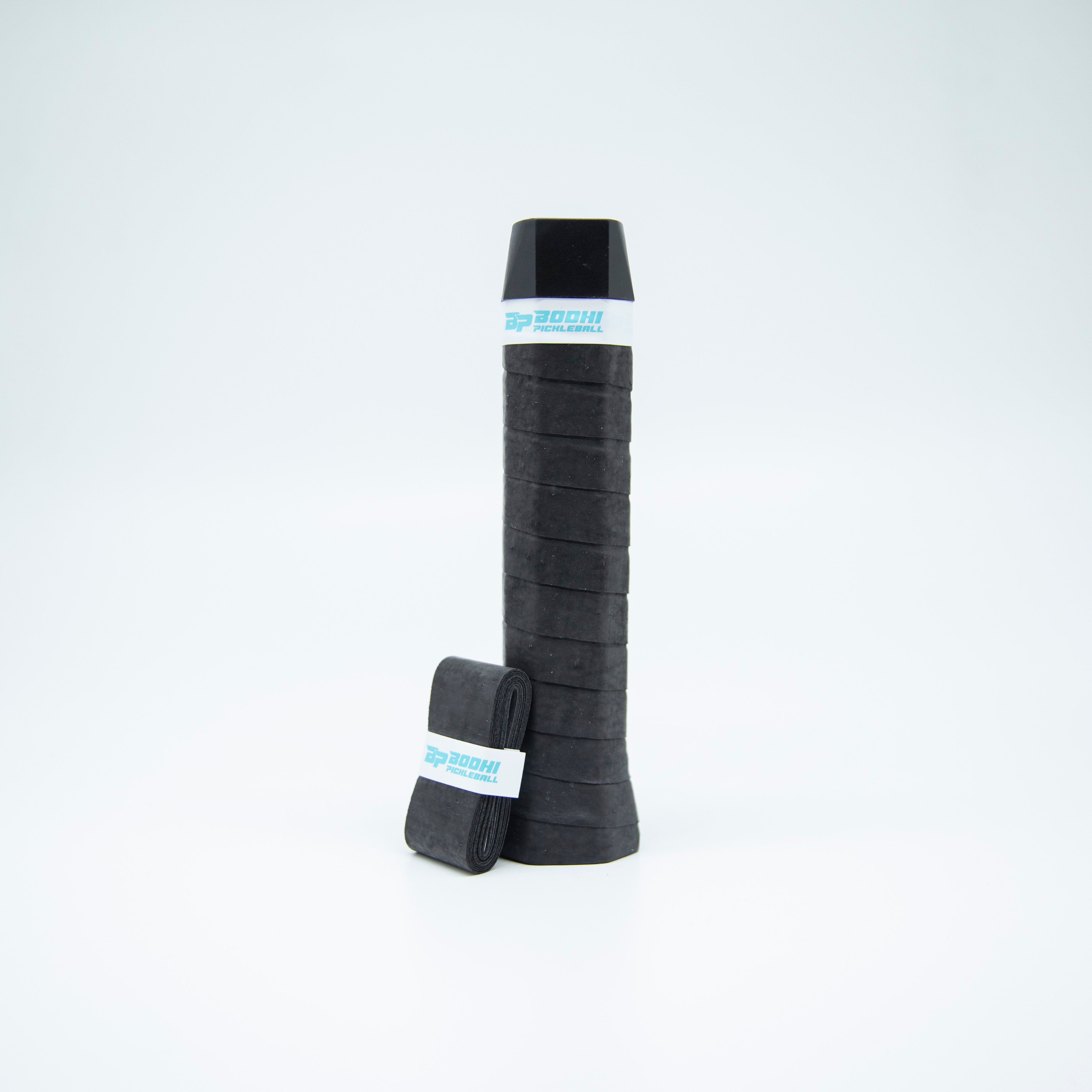 Black pickleball paddle grip with blue logo label.