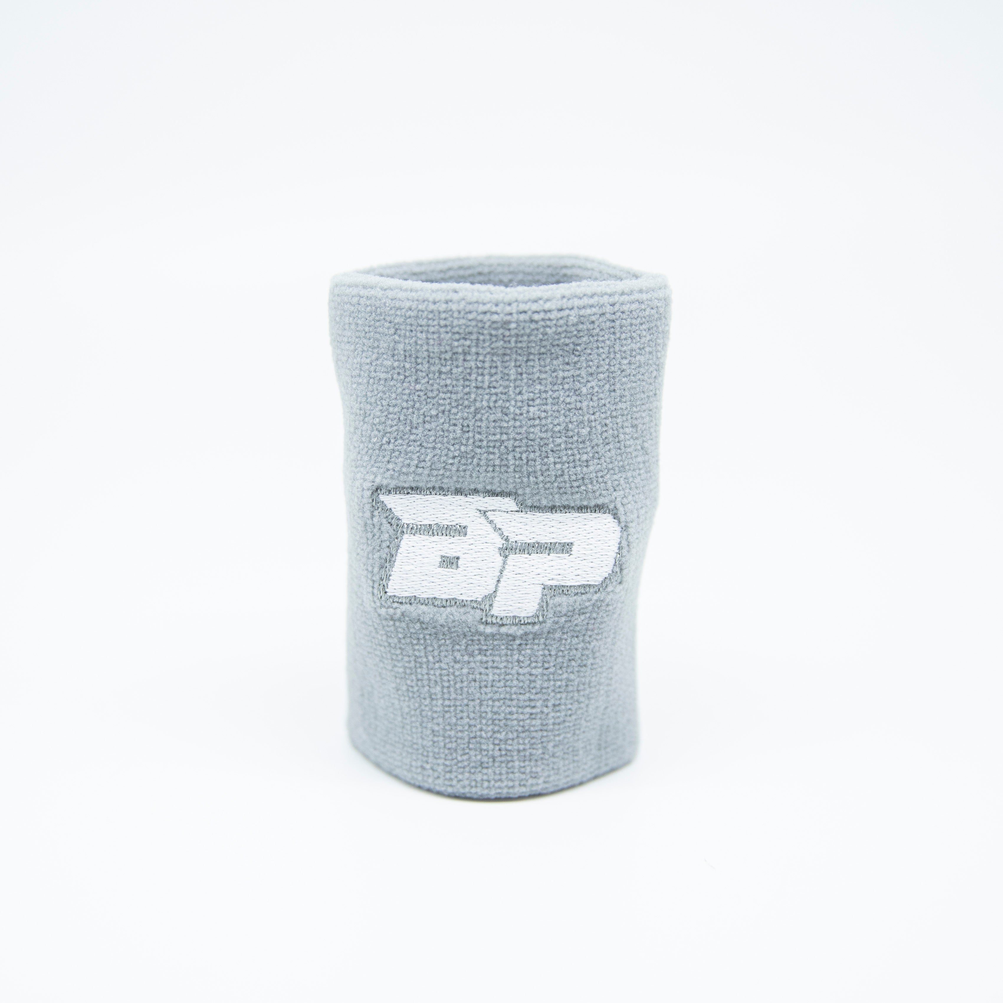 Gray wristband with a white logo.
